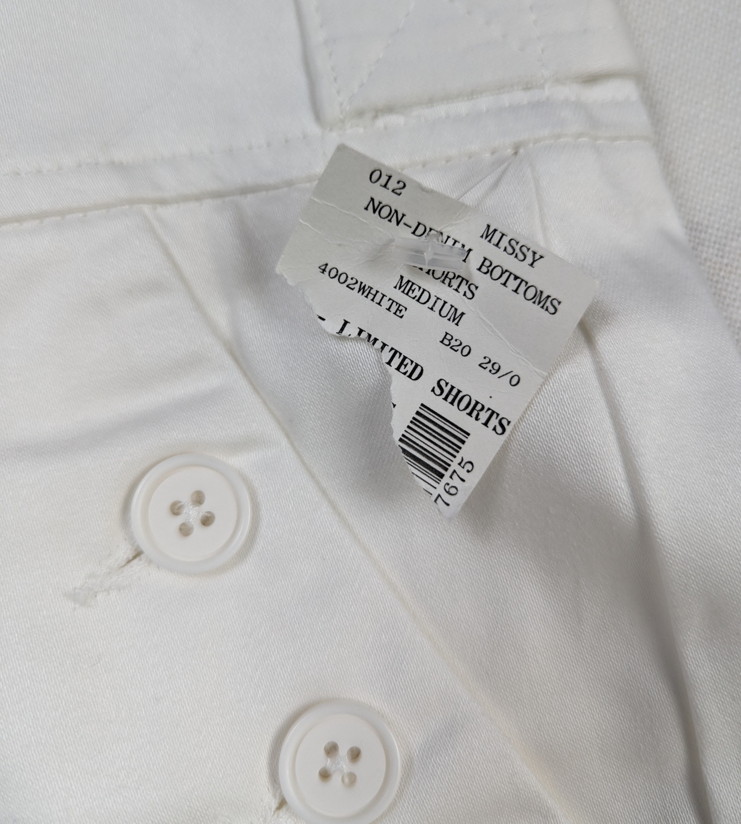 The Limited White Shorts Size 4 - NWT Stay cool and stylish in these Limited White Shorts, featuring front pockets with 3-button closure and back flap pockets for com