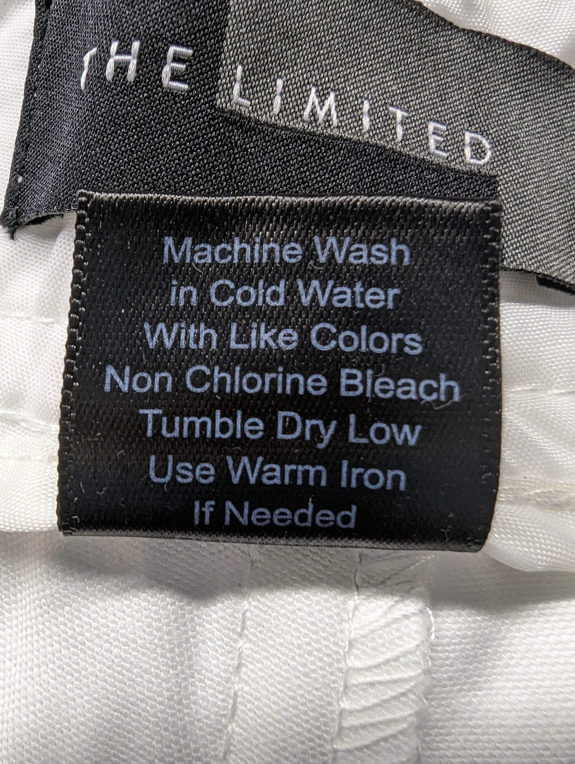 The Limited White Shorts Size 4 - NWT Stay cool and stylish in these Limited White Shorts, featuring front pockets with 3-button closure and back flap pockets for com