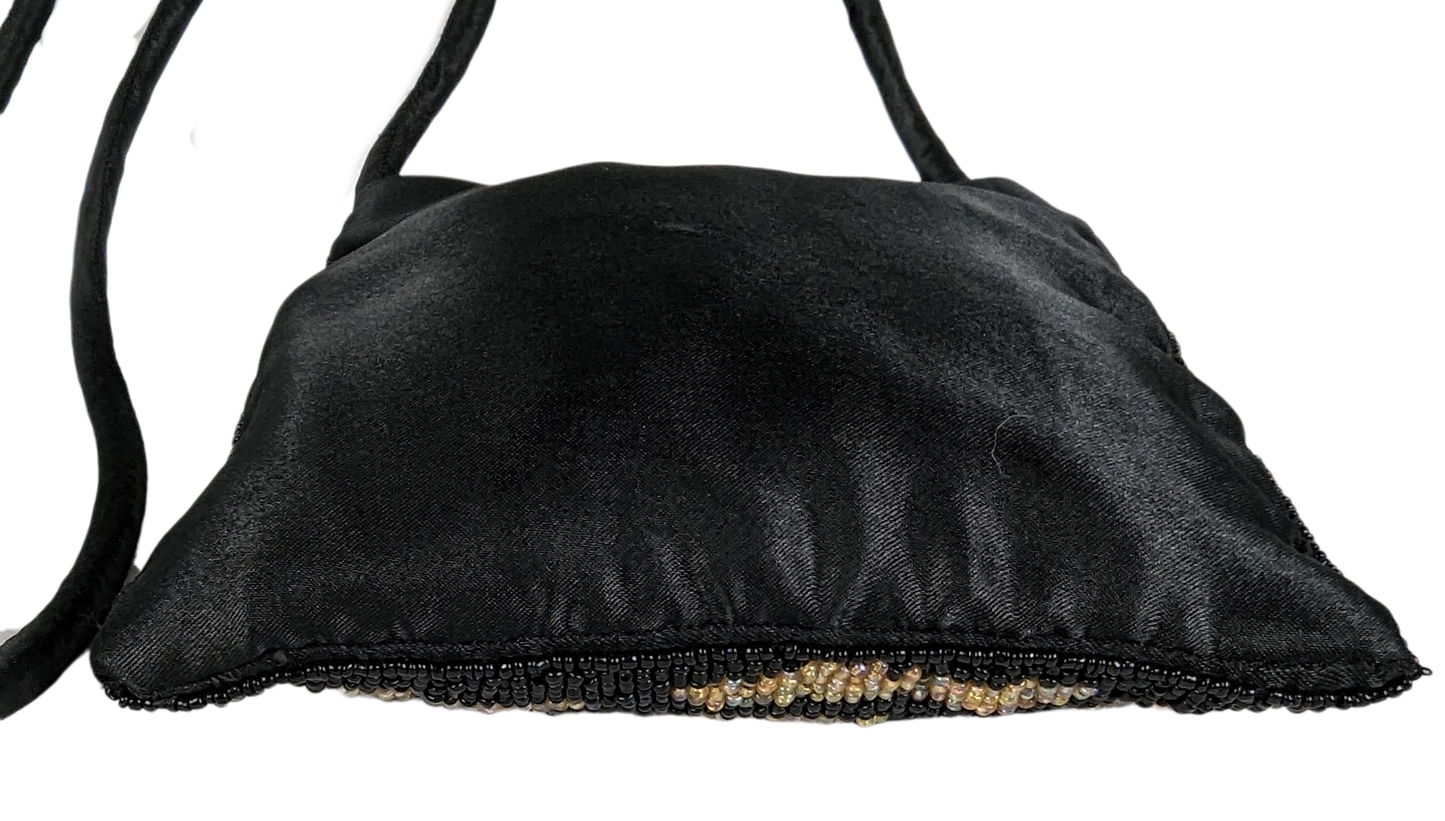 Beaded Zebra Handbag with Long Strap - Unbranded. Measures:   L - 6 1/2"   W - 1/2"   H - 7"  Strap - 42"HandbagBeaded Zebra HandbagBeaded Zebra Handbag