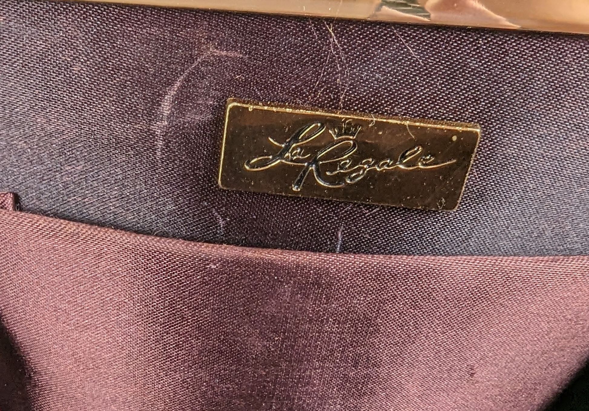 La Regale Plum Satin Evening Bag Just the right bag for a night out; phone, lipstick, keys. Done.PurseLa Regale Plum Satin Evening BagLa Regale Plum Satin Evening Bag