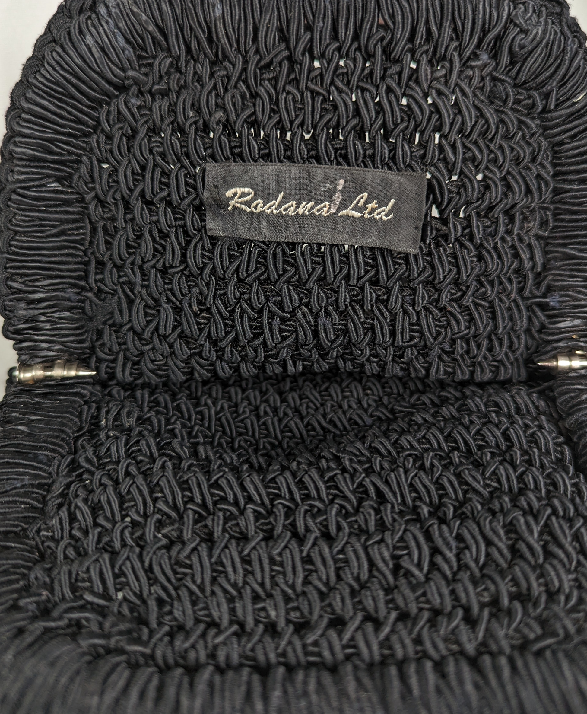 Rodanan Ltd.Perfect bag for evening out or brunch with the girls!  
Measures:   L - 7"  W - 1"  H - 8"  Strap - 11"HandbagVintage Rodana Ltd. Crochet HandbagVintage Rodana
