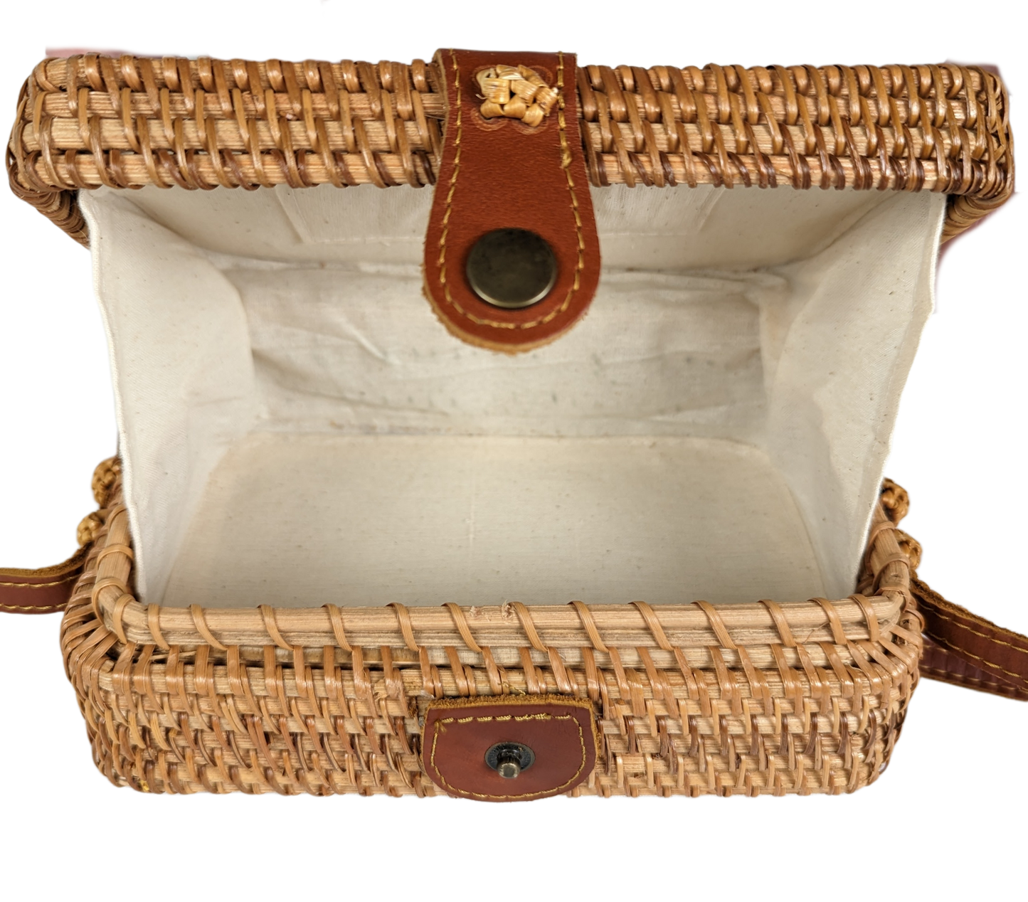 Rectangular Wicker Handbag with Leather Strap and Closure Perfect for summertime, this little purse is ideal for a day shopping or out to brunch.  Measurements:  L - 7 1/2"   W - 3"    H - 5"   Strap - 50"HandbagWicker Rectangular Purse with Leather Strap and ClosureWicker Rectangular Purse