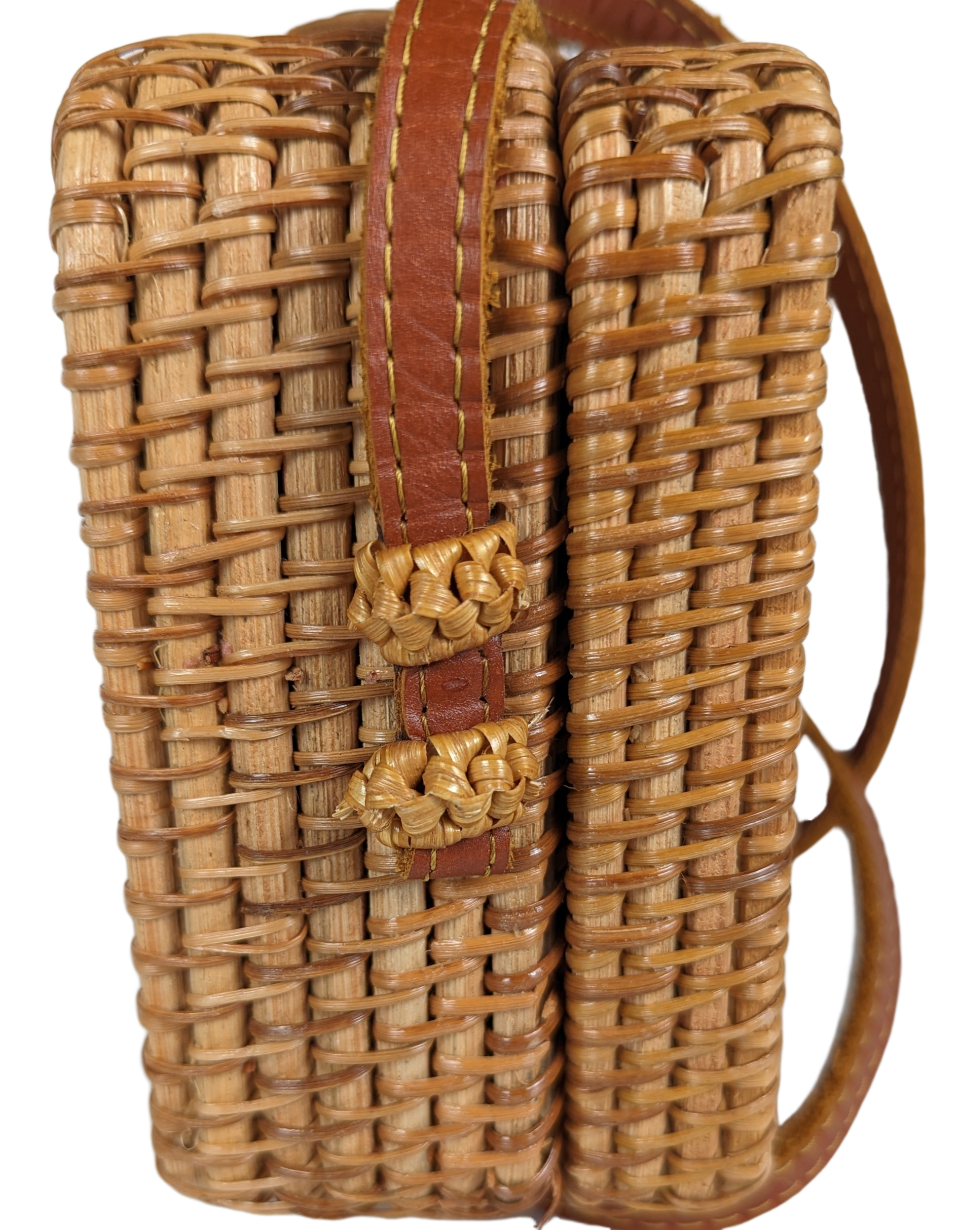 Rectangular Wicker Handbag with Leather Strap and Closure Perfect for summertime, this little purse is ideal for a day shopping or out to brunch.  Measurements:  L - 7 1/2"   W - 3"    H - 5"   Strap - 50"HandbagWicker Rectangular Purse with Leather Strap and ClosureWicker Rectangular Purse