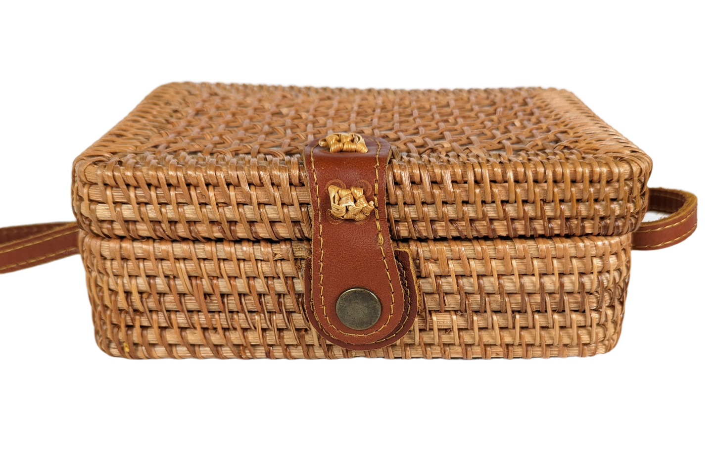 Rectangular Wicker Handbag with Leather Strap and Closure Perfect for summertime, this little purse is ideal for a day shopping or out to brunch.  Measurements:  L - 7 1/2"   W - 3"    H - 5"   Strap - 50"HandbagWicker Rectangular Purse with Leather Strap and ClosureWicker Rectangular Purse