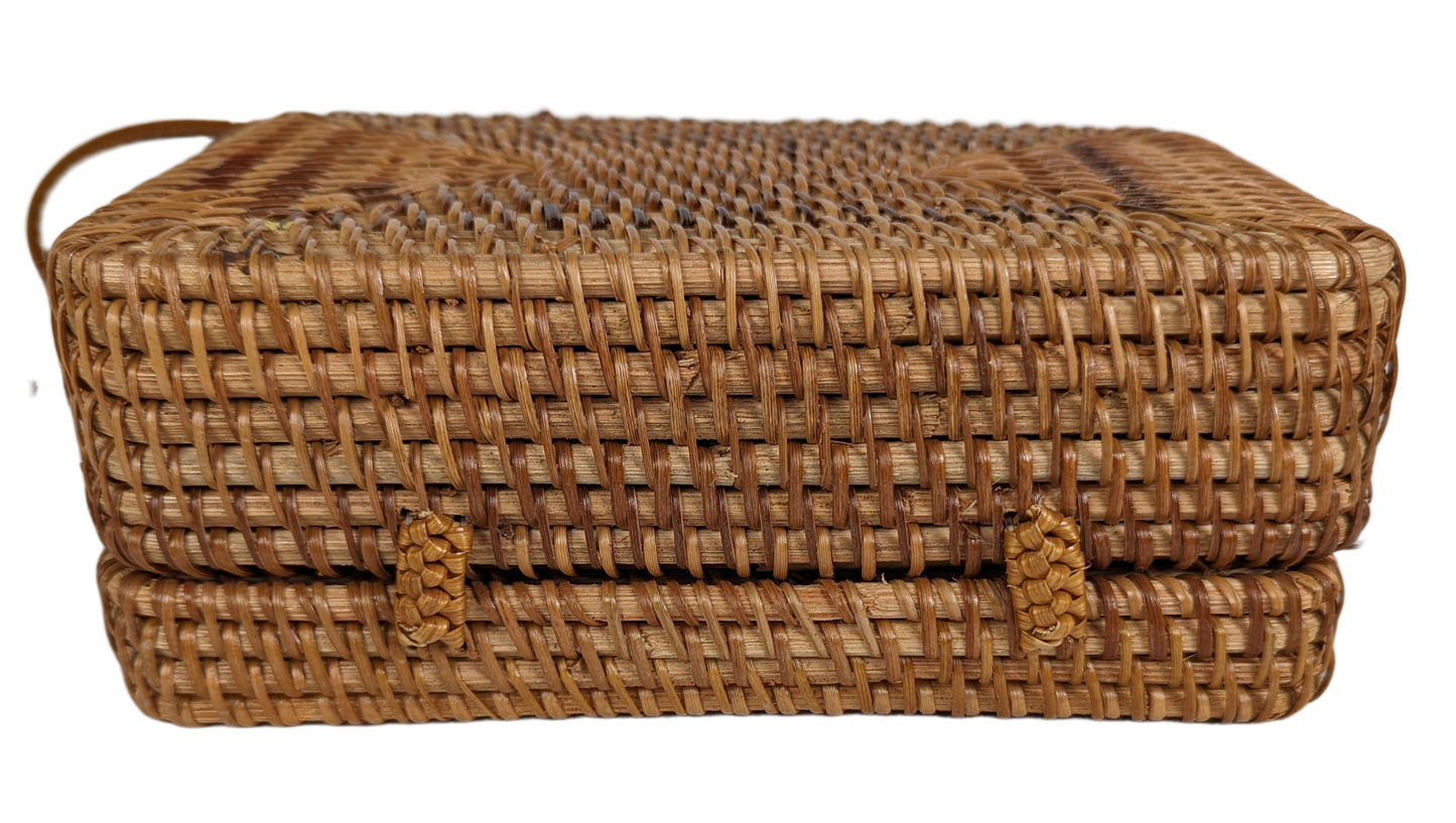 Rectangular Wicker Handbag with Leather Strap and Closure Perfect for summertime, this little purse is ideal for a day shopping or out to brunch.  Measurements:  L - 7 1/2"   W - 3"    H - 5"   Strap - 50"HandbagWicker Rectangular Purse with Leather Strap and ClosureWicker Rectangular Purse