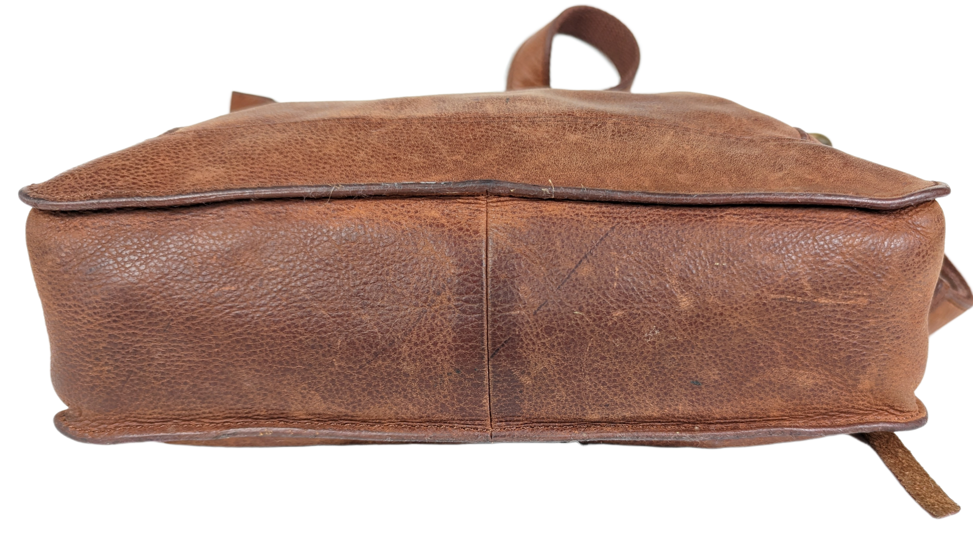 Lucky BrandBeautiful, well-worn leather purse.  Large zip pockets in front and back, and three pockets on inside.  Small pen mark, seen in photo.Purse, handbagLucky Brand Studded Leather PurseLucky Brand Studded Leather Purse