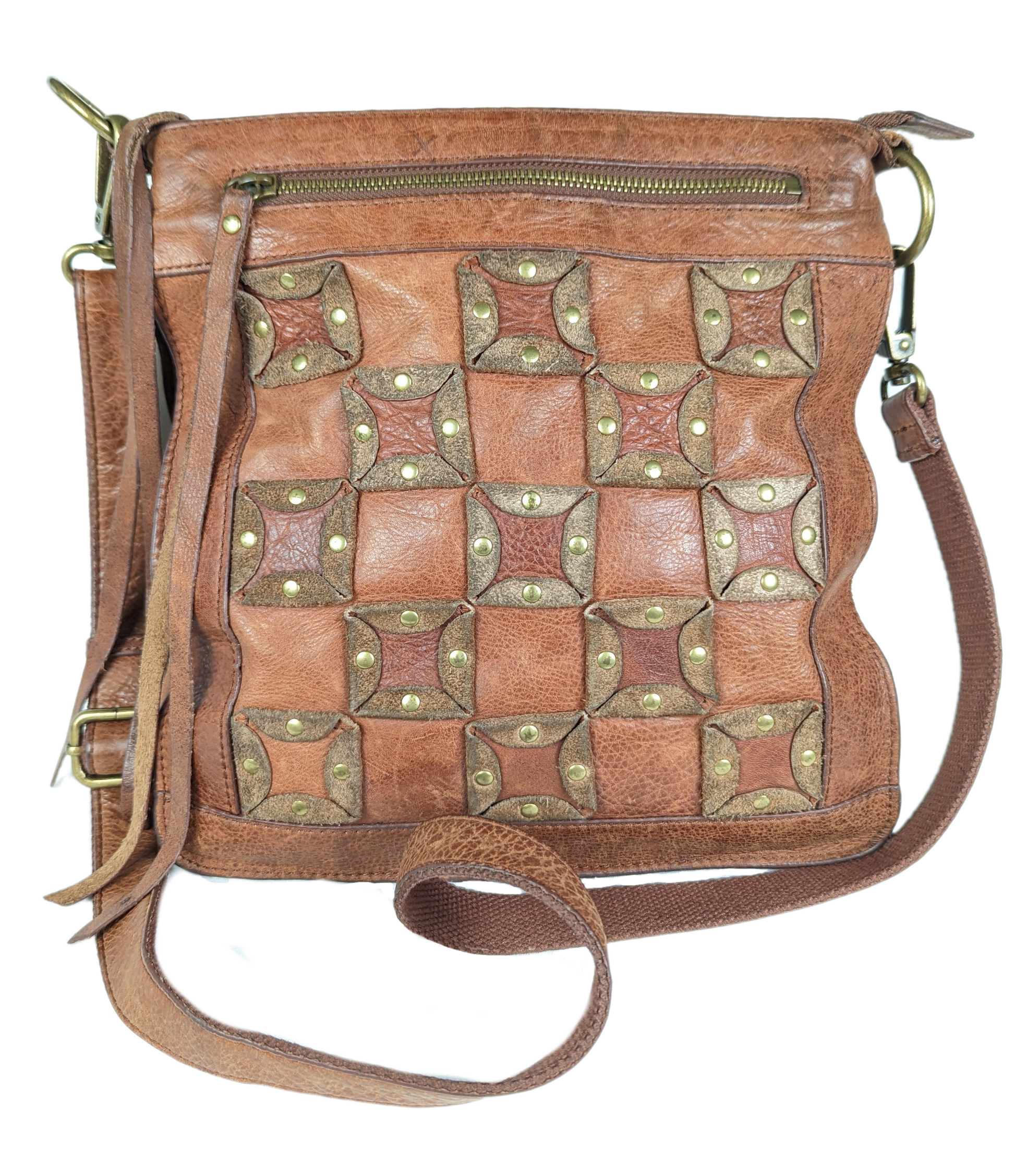 Lucky BrandBeautiful, well-worn leather purse.  Large zip pockets in front and back, and three pockets on inside.  Small pen mark, seen in photo.Purse, handbagLucky Brand Studded Leather PurseLucky Brand Studded Leather Purse