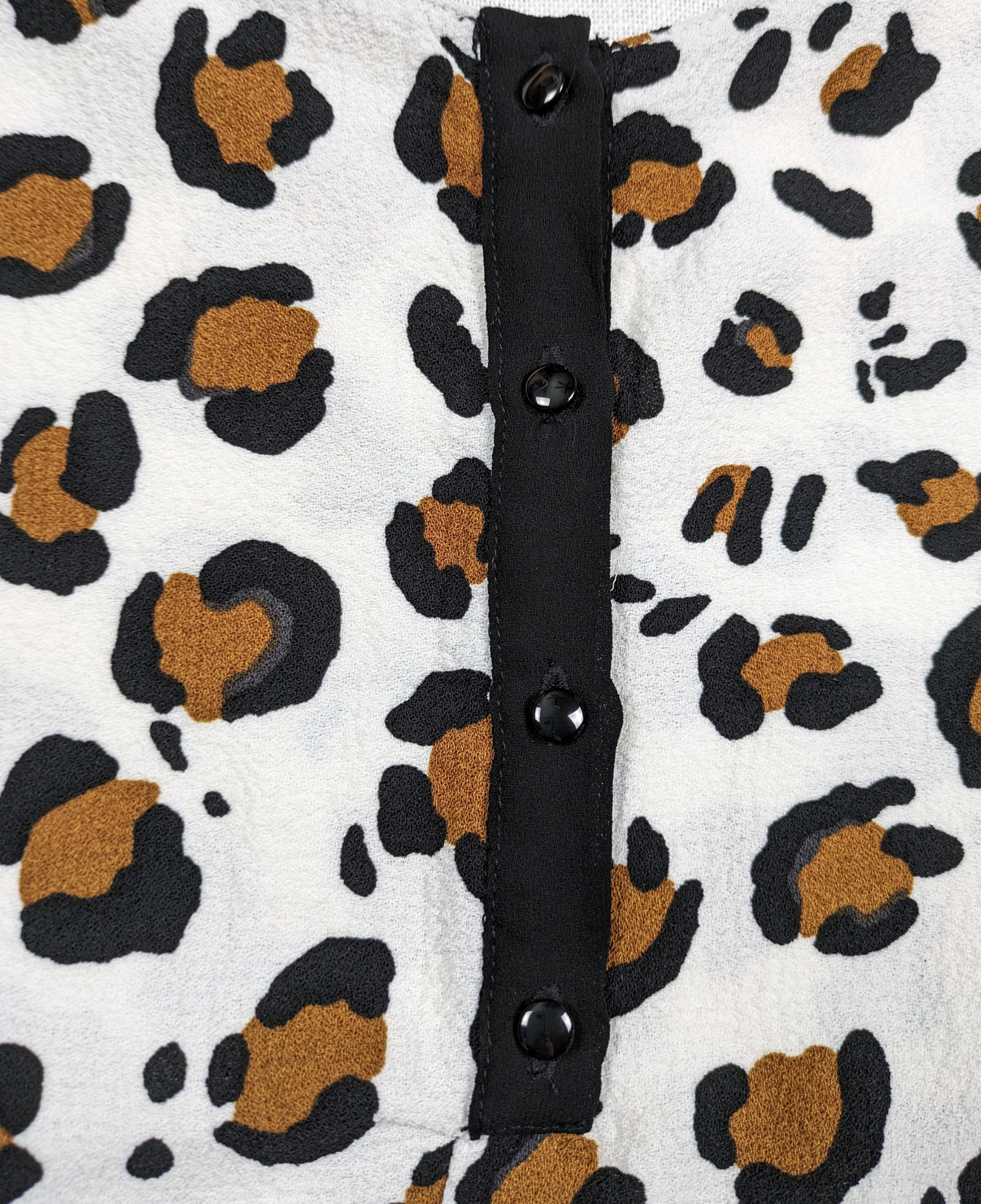 Zara Animal Print Short Sleeve Blouse with Peplum Size Large - NWT Unleash your wild side with our Zara Animal Print Blouse! This playful short sleeve top features a