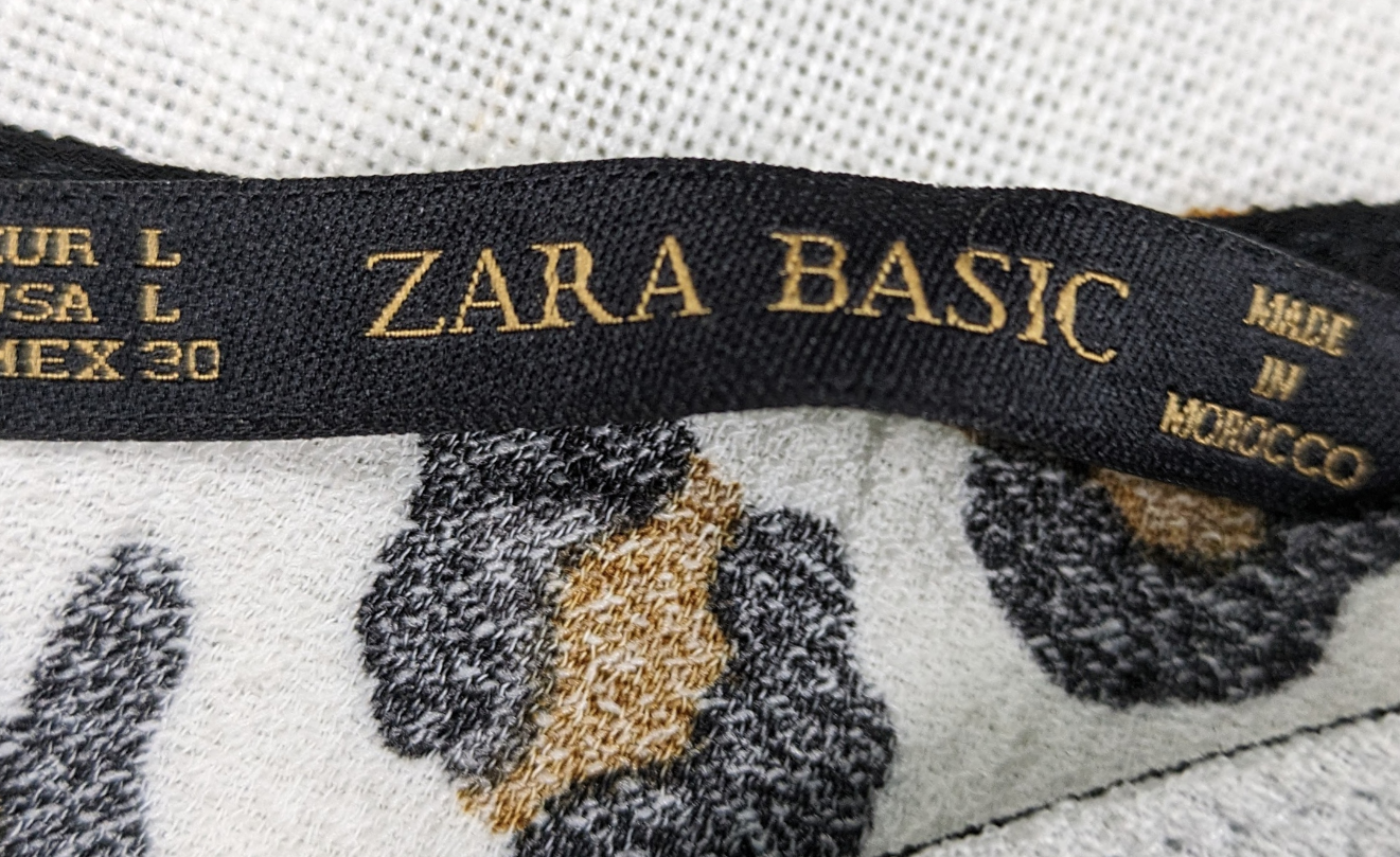 Zara Animal Print Short Sleeve Blouse with Peplum Size Large - NWT Unleash your wild side with our Zara Animal Print Blouse! This playful short sleeve top features a