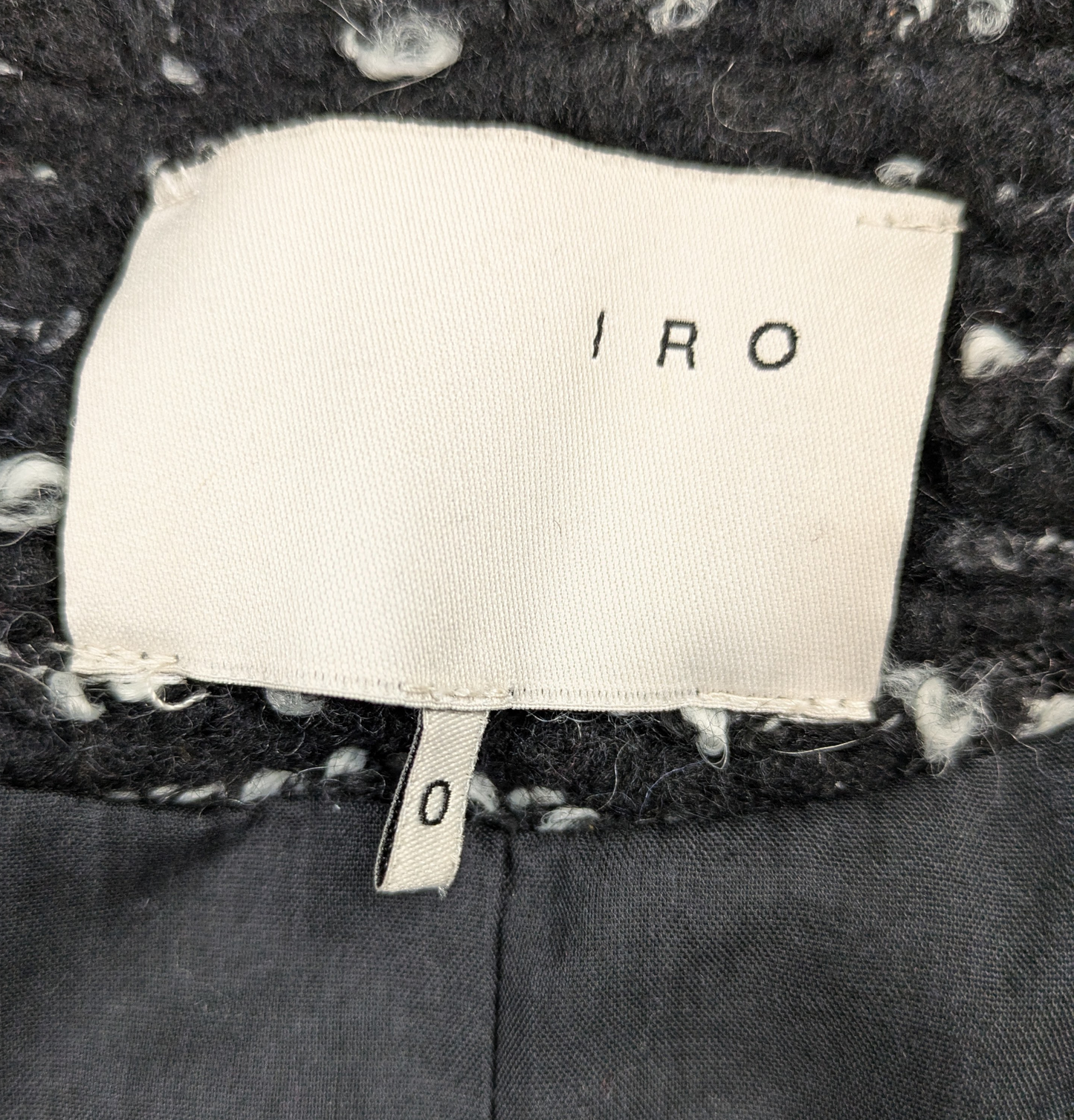 Iro Tweed Pattern Boucle Black & White Jacket Size 0 Indulge in style and luxury with our Iro Tweed Pattern Boucle Jacket. The elegant tweed pattern in classic black