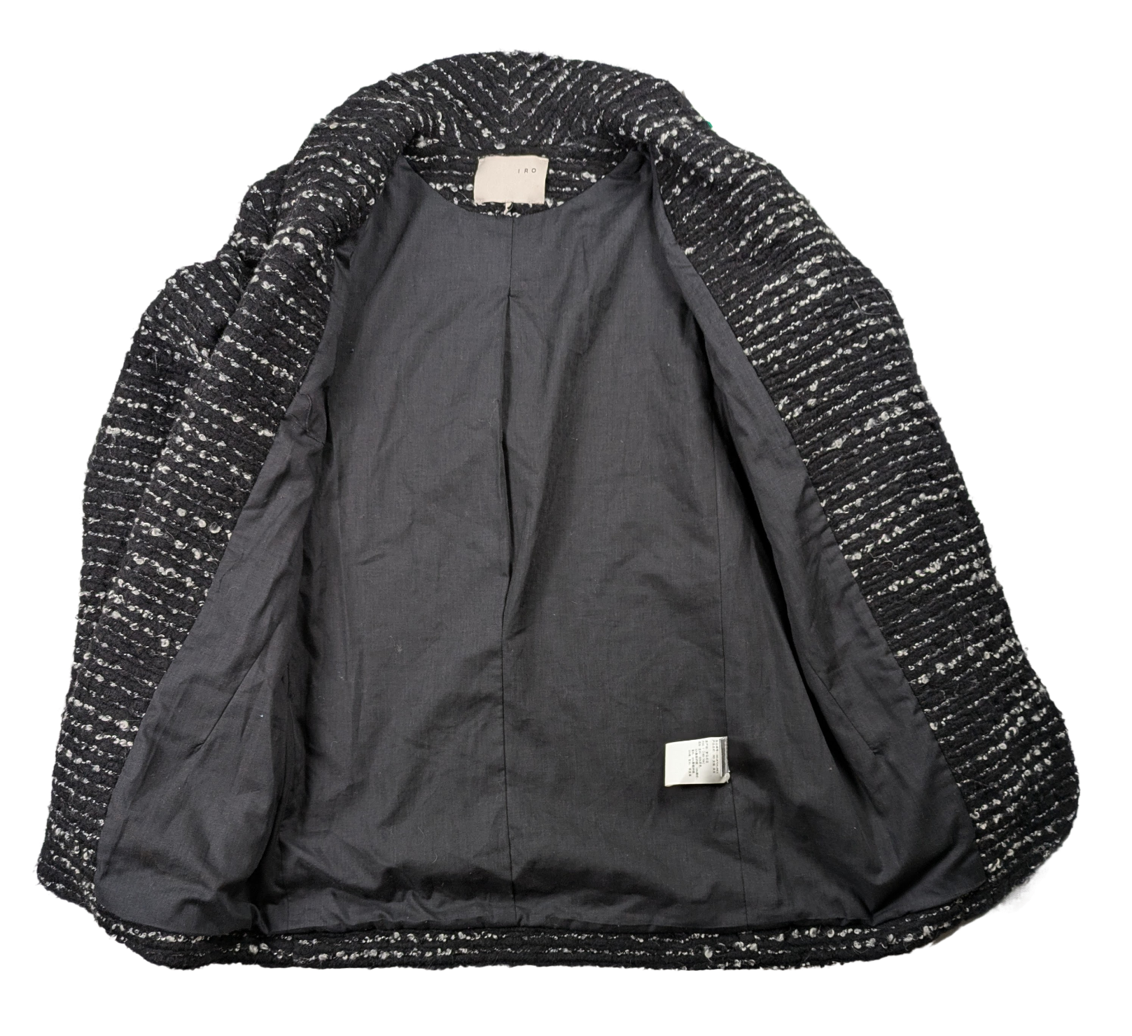 Iro Tweed Pattern Boucle Black & White Jacket Size 0 Indulge in style and luxury with our Iro Tweed Pattern Boucle Jacket. The elegant tweed pattern in classic black