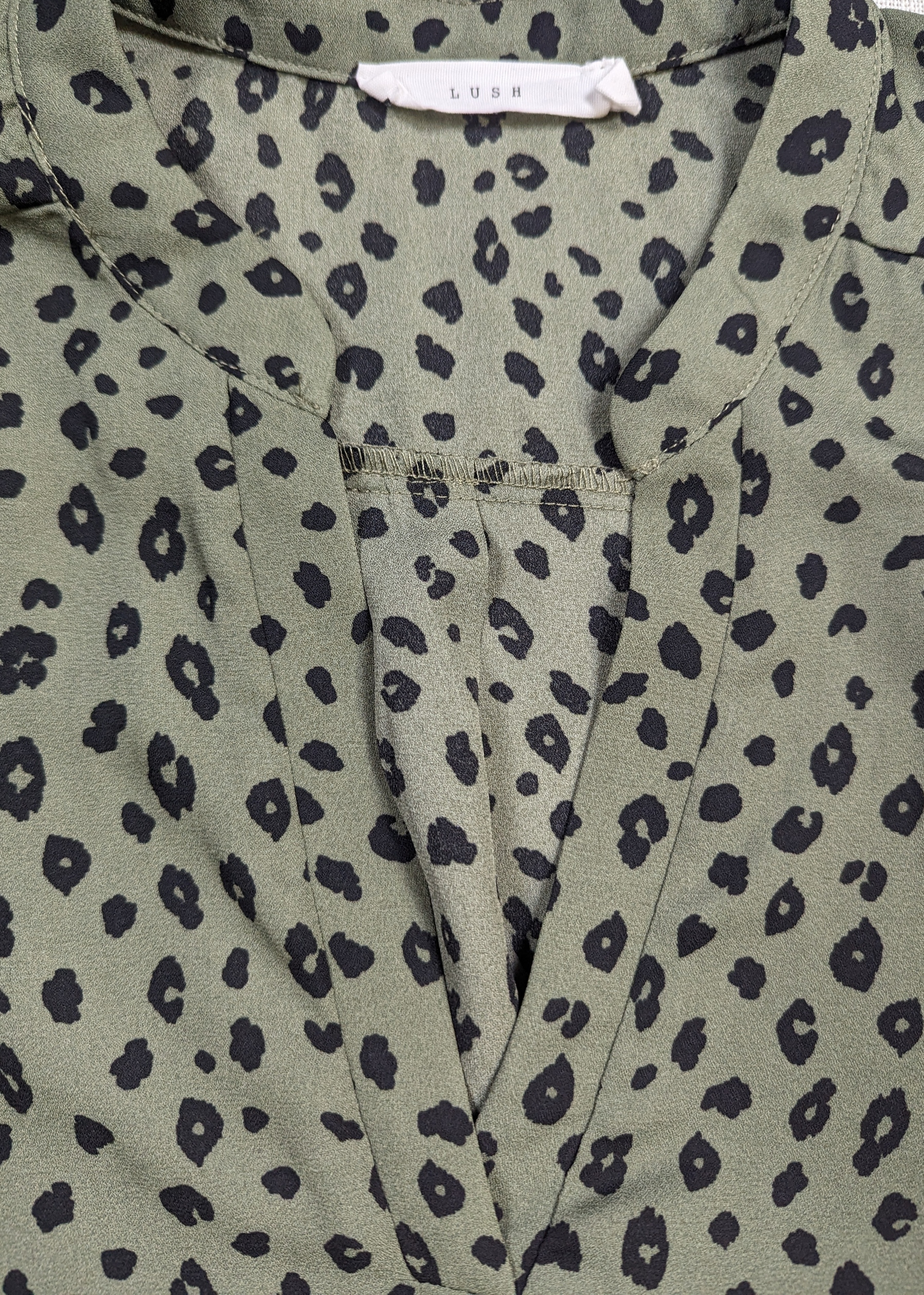 Lush Olive Green Dalmation Print Blouse Size Large Get ready to turn heads with this playful Lush Olive Green Dalmation Print Blouse in size Large! The unique Dalmat