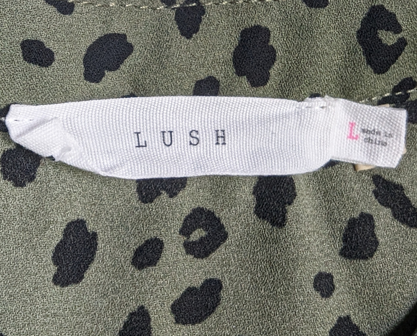 Lush Olive Green Dalmation Print Blouse Size Large Get ready to turn heads with this playful Lush Olive Green Dalmation Print Blouse in size Large! The unique Dalmat