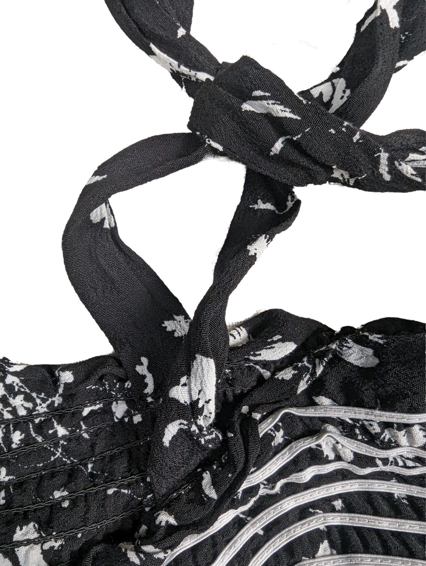 Free People Black and White Smocked Jumpsuit Size XS Go bold and free with the Free People Jumpsuit! This black and white stunner features adjustable shoulder ties a