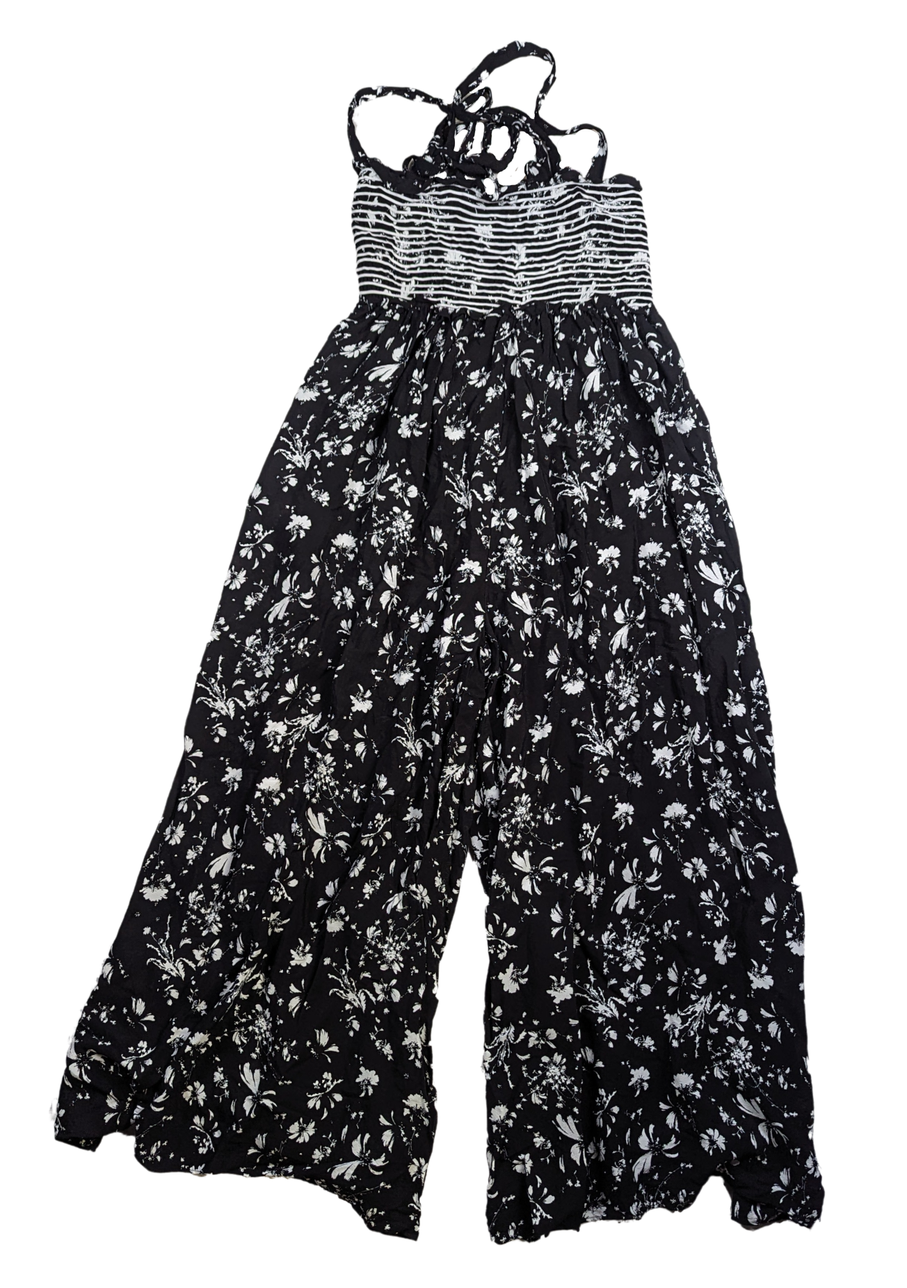 Free People Black and White Smocked Jumpsuit Size XS Go bold and free with the Free People Jumpsuit! This black and white stunner features adjustable shoulder ties a