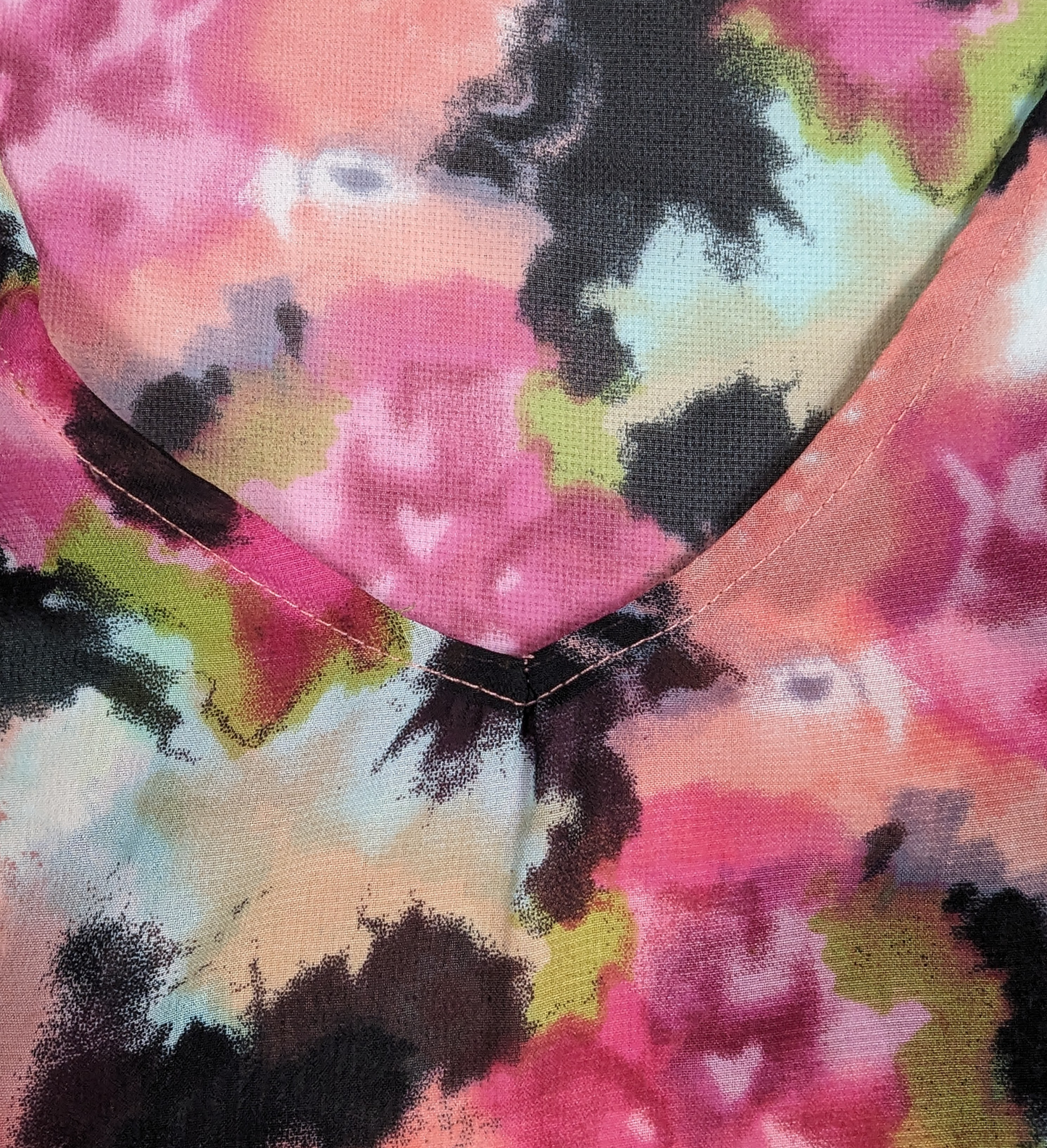 Show Me Your MuMu Abstract Print Sheer Top Be bold and playful in the Show Me Your MuMu Abstract Print Sheer Top. This semi-sheer top features a vibrant abstract floral print, perfect for making a statement.