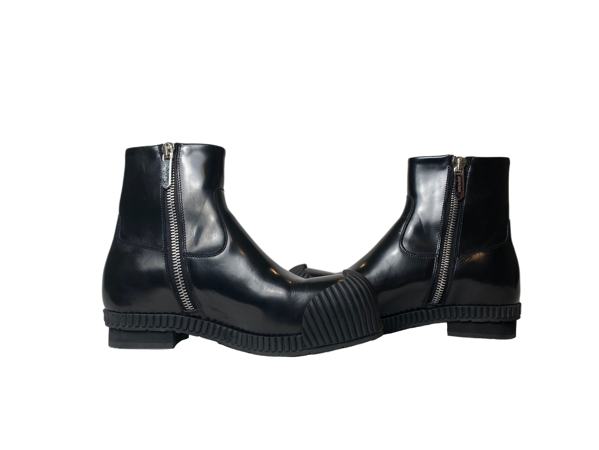 Calvin KleinStep up your fashion game with these Calvin Klein Deicine Spazzolato (205W39NYC) black leather ankle boots! These sleek and stylish boots are dressed to kill with a ShoesCalvin Klein Deicine Spazzolato Black Leather Ankle BootsCalvin Klein Deicine Spazzolato Black Leather Ankle Boots