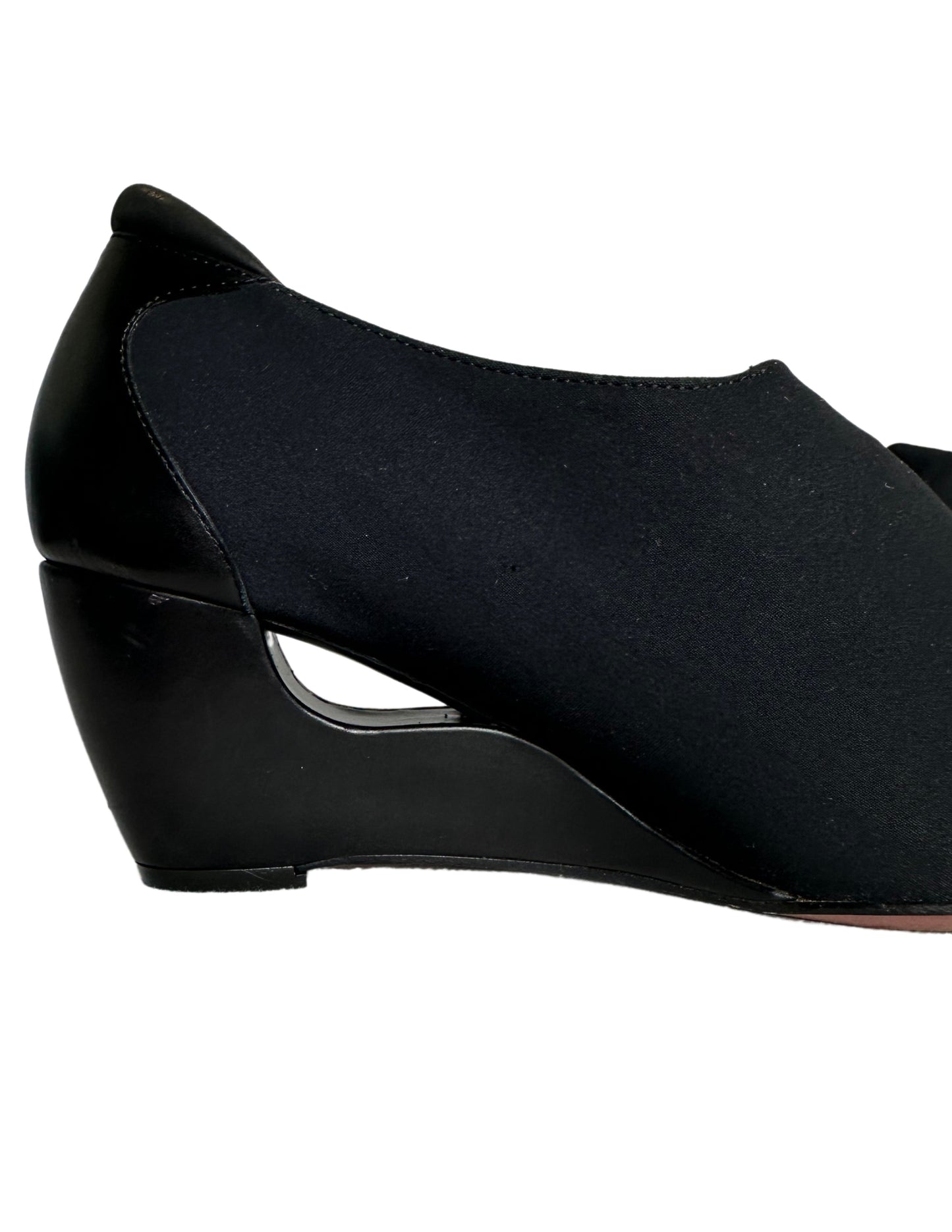 Donald J Pliner Couture Donald J Pliner Couture Stretch Textile & Leather Pumps Wedge Size 7.5 Indulge in luxury with Donald J Pliner Couture's Italian-made leather pumps. Featuring a stunnTextile & Leather Pumps Cut out Wedge Size 7.5 Indulge in luxury with Donald J Pliner Couture's Italian-made leather pumps. Featuring