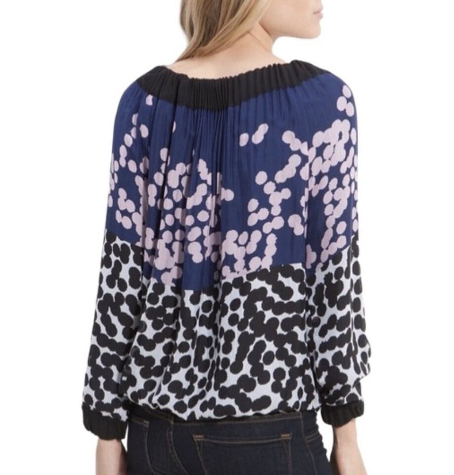 Diane Von Furstenberg Mikino Pleated Neckline Blou The stunning Diane Von Furstenberg Multi Color Printed Mikino Pleated Neckline Blouse is the perfect way to make a statement with artfully-crafted chiffon creating a