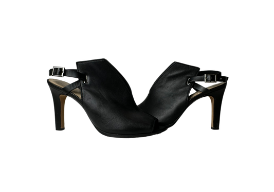 Vince Camuto Black Leather Sling Back Mules provide a statement-making look with their sleek, sophisticated design featuring a peep toe, leather upper and stilShoesVince Camuto Black Leather Sling Back MulesVince Camuto Black Leather Sling Back Mules