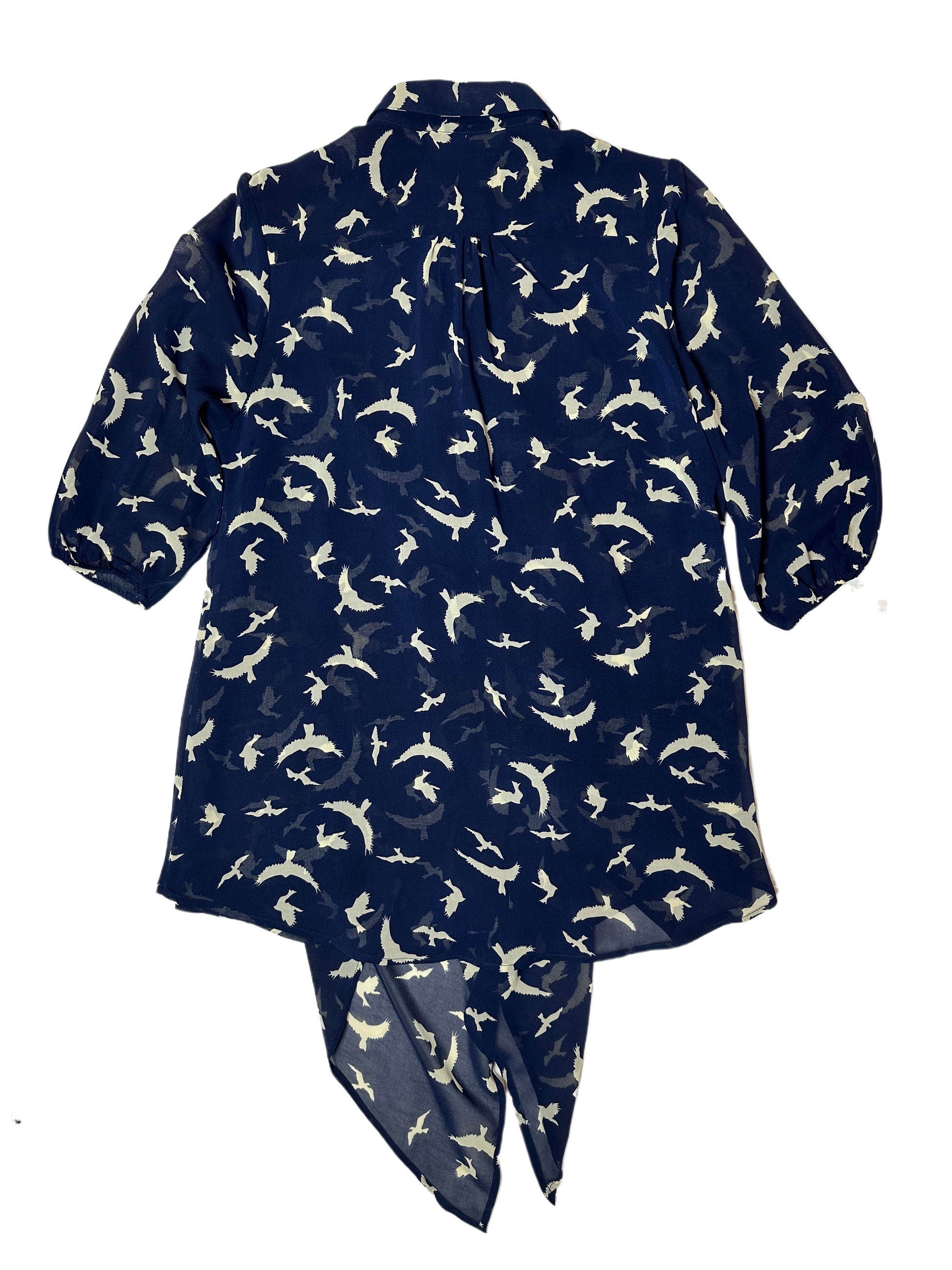 Live a Little Bird Print Blouse with Flowy Front is both stylish and fun. Featuring a unique bird pattern, slightly puffy sleeves, and a flowy front with button closure, this daShirtLive a Little Bird Print Blouse with Flowy FrontBird Print Blouse