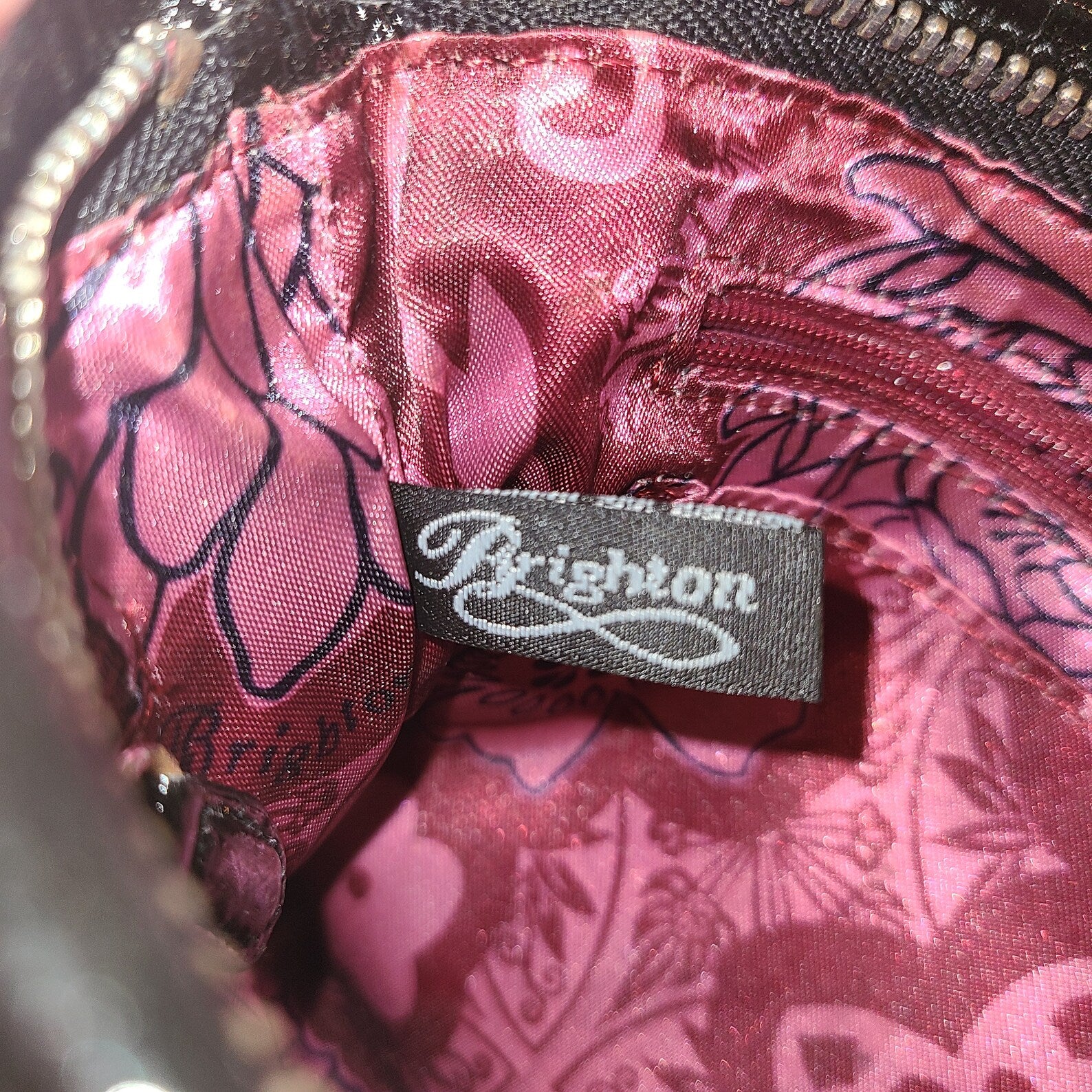 Brighton Black Ruched Nylon Evening Bag with heavy, silver rose detail adorning the front! This is a perfect evening bag to fit all your essentials. It has extra room for lipstPurse, handbagBrighton Black Ruched Nylon Evening BagBrighton Black Ruched Nylon Evening Bag