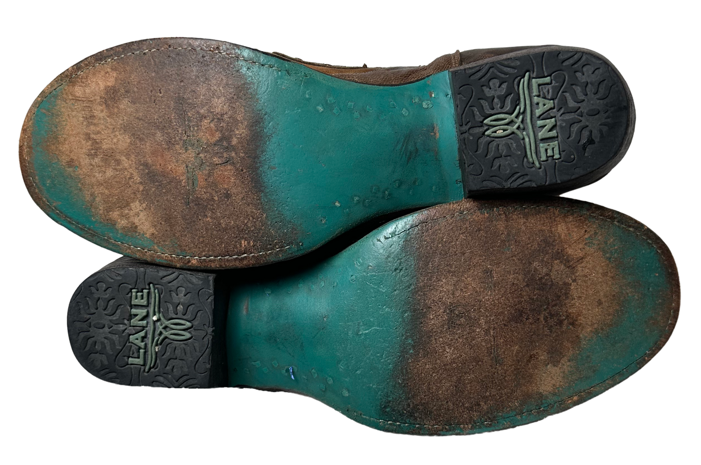 Lane Boots Brown with Cut-Outs, Studs and Side Zips Cowboy Cowgirl Slip into these Lane Boots with ease thanks to the convenient side zips, while the round toe and l