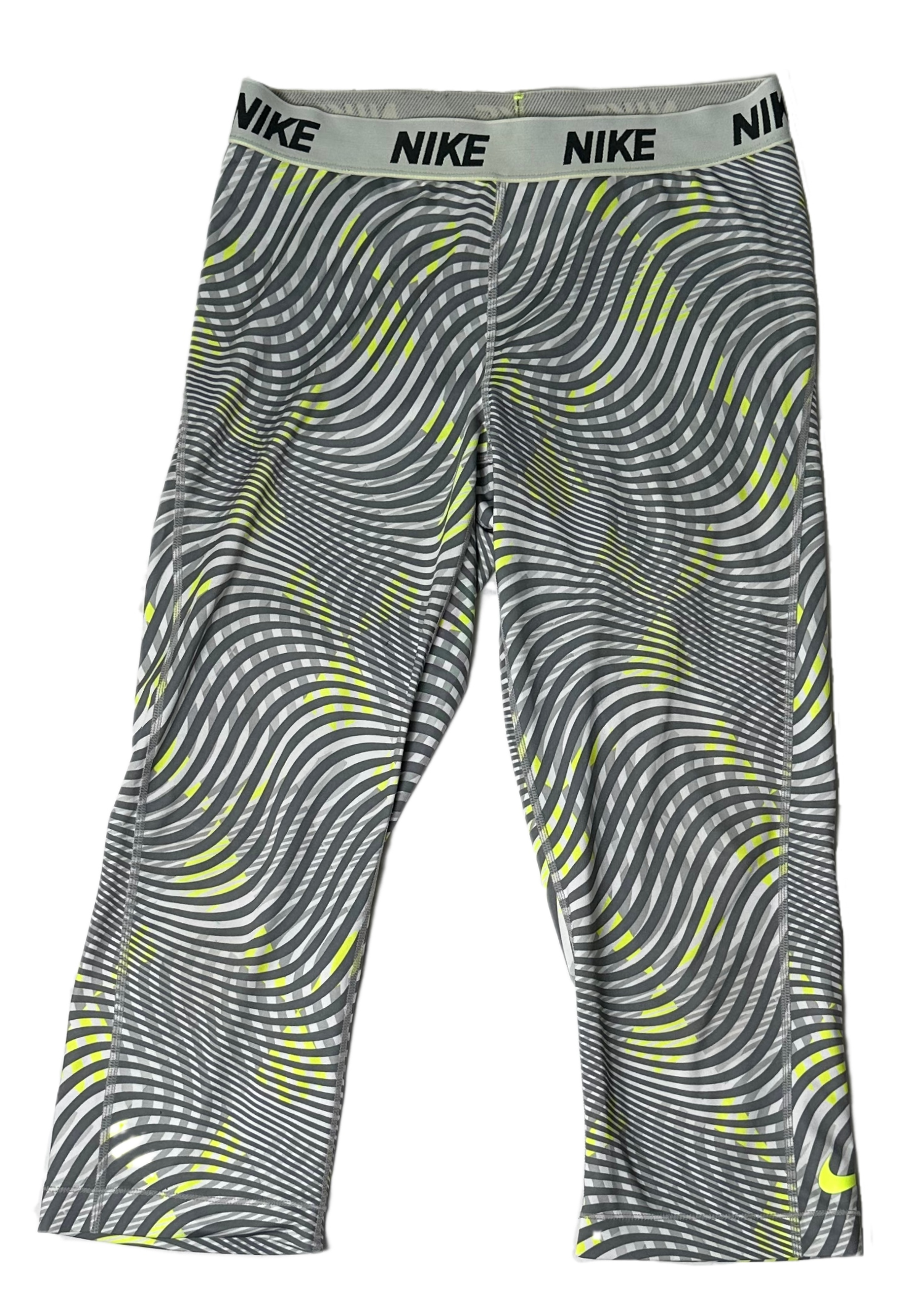 NikeTear through your workout with these Nike Dri Fit cropped leggings! Made with a sleek grey and lime green swirl print, these moisture-wicking leggings will make sureLeggingsNike Dri Fit Cropped Grey Print LeggingsNike Dri Fit Cropped Grey Print Leggings