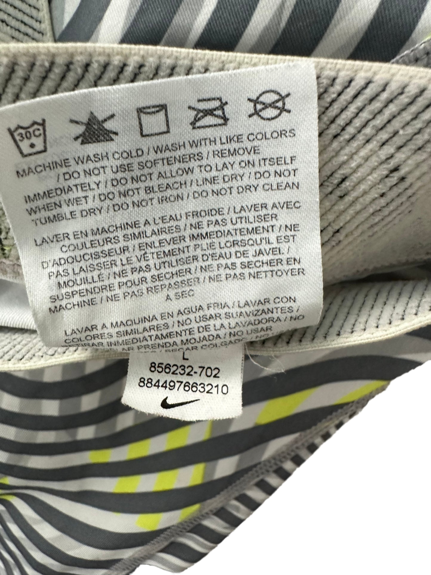 NikeTear through your workout with these Nike Dri Fit cropped leggings! Made with a sleek grey and lime green swirl print, these moisture-wicking leggings will make sureLeggingsNike Dri Fit Cropped Grey Print LeggingsNike Dri Fit Cropped Grey Print Leggings