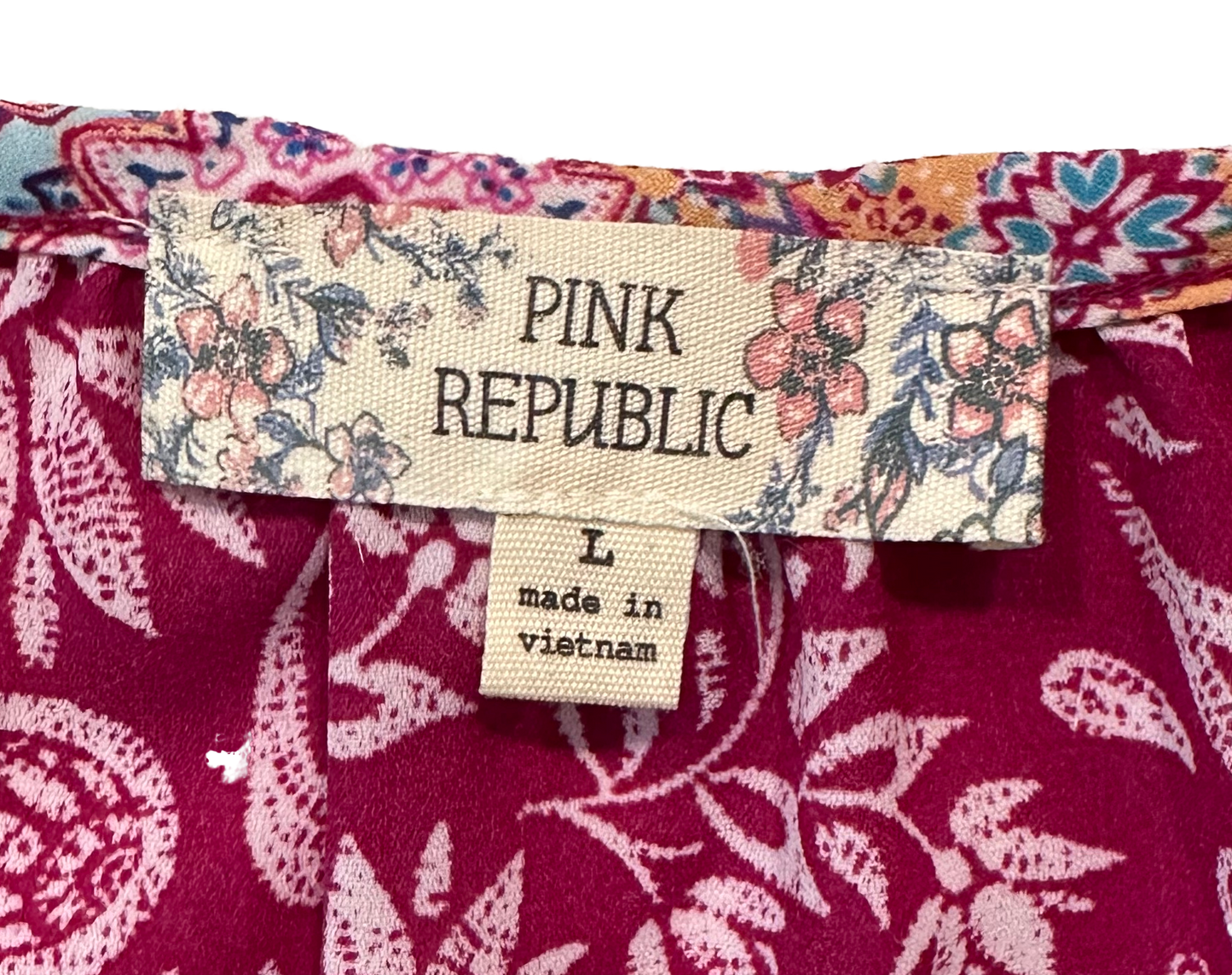 Pink RepublicLook classy and sassy in this Pink Republic sleeveless shirt! With a hot pink hue and a wild floral print, you'll ooze with the ultimate bohemian vibes. Its flowy faShirtPink Republic Sleeveless Floral Print Tie V-neck ShirtPink Republic Sleeveless Floral Print Tie