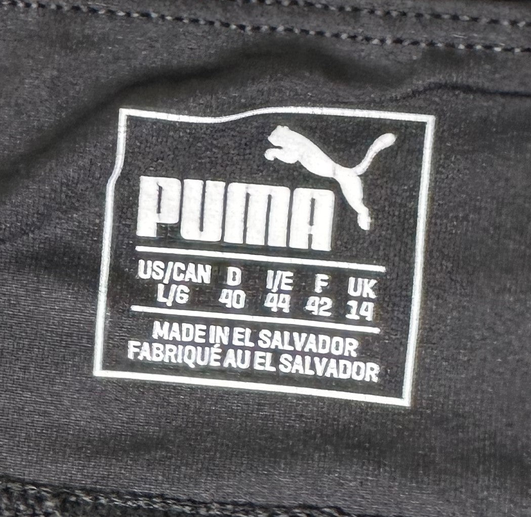 PumaMake a statement in this sleek black legging, featuring a large Puma Logo graphic on the side. Whether you're working out or hanging out, you'll look cool and feel cLeggingsPuma Black Legging with Large Puma Logo GraphicLarge Puma Logo Graphic