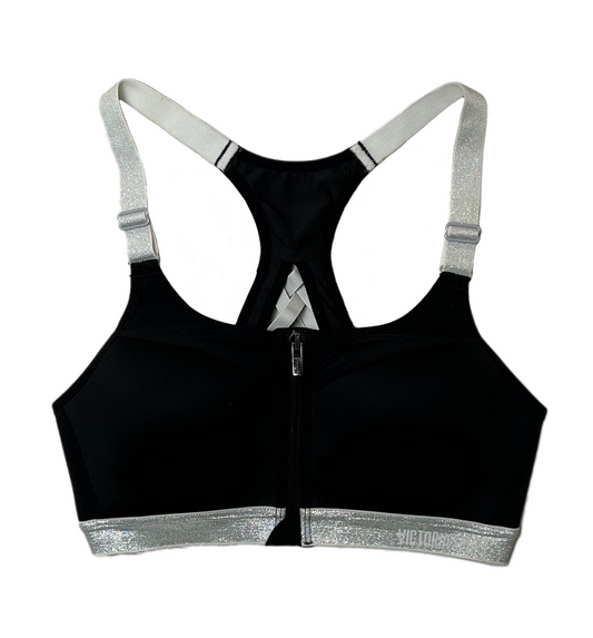 Victoria Secret Sports Bra Black with Silver Straps and band Feel on top of the world while running, jumping, and stretching in this sporty Victoria Secret Sports bra. This black beauty is equipped with removable pads, a zip fSports BraVictoria Secret Sports Bra Black with Silver Straps and bandVictoria Secret Sports Bra Black