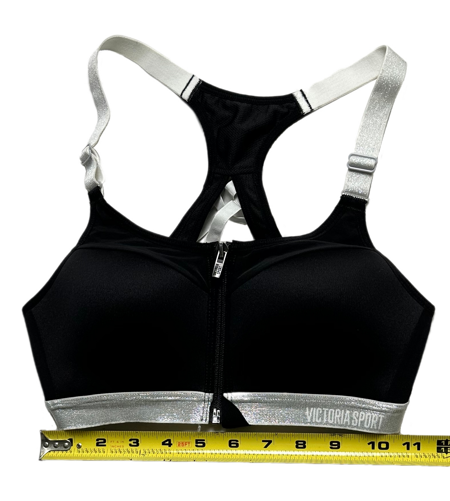 Victoria Secret Sports Bra Black with Silver Straps and band Feel on top of the world while running, jumping, and stretching in this sporty Victoria Secret Sports bra. This black beauty is equipped with removable pads, a zip fSports BraVictoria Secret Sports Bra Black with Silver Straps and bandVictoria Secret Sports Bra Black