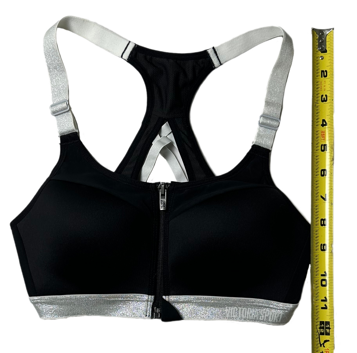 Victoria Secret Sports Bra Black with Silver Straps and band Feel on top of the world while running, jumping, and stretching in this sporty Victoria Secret Sports bra. This black beauty is equipped with removable pads, a zip fSports BraVictoria Secret Sports Bra Black with Silver Straps and bandVictoria Secret Sports Bra Black