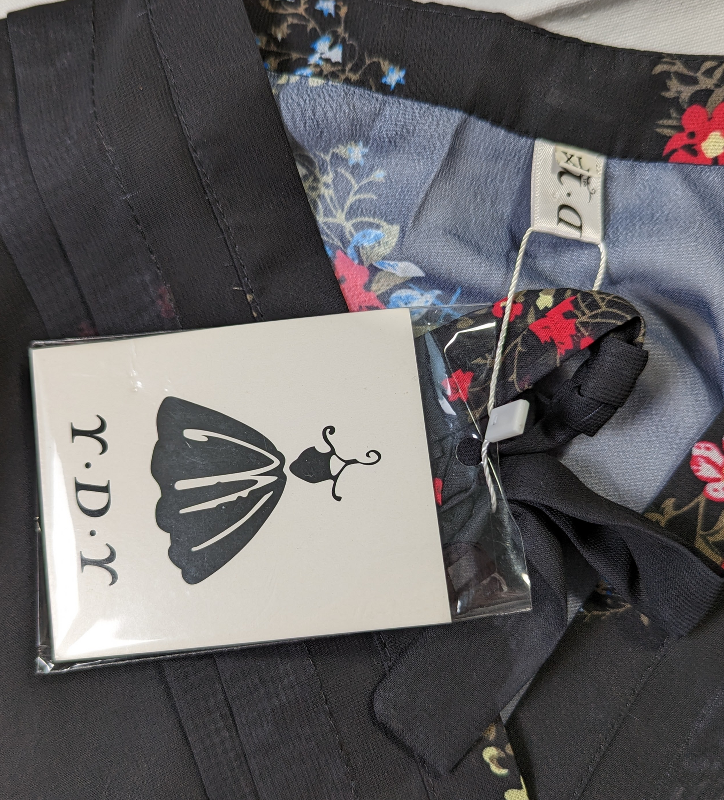 YDYThis YDY dress is perfect for any occasion. The black background with red and blue flowers create a timeless look. The sheer back and sleeves create a modern yet modDressesYDY Black Floral Dress NWTYDY Black Floral Dress NWT