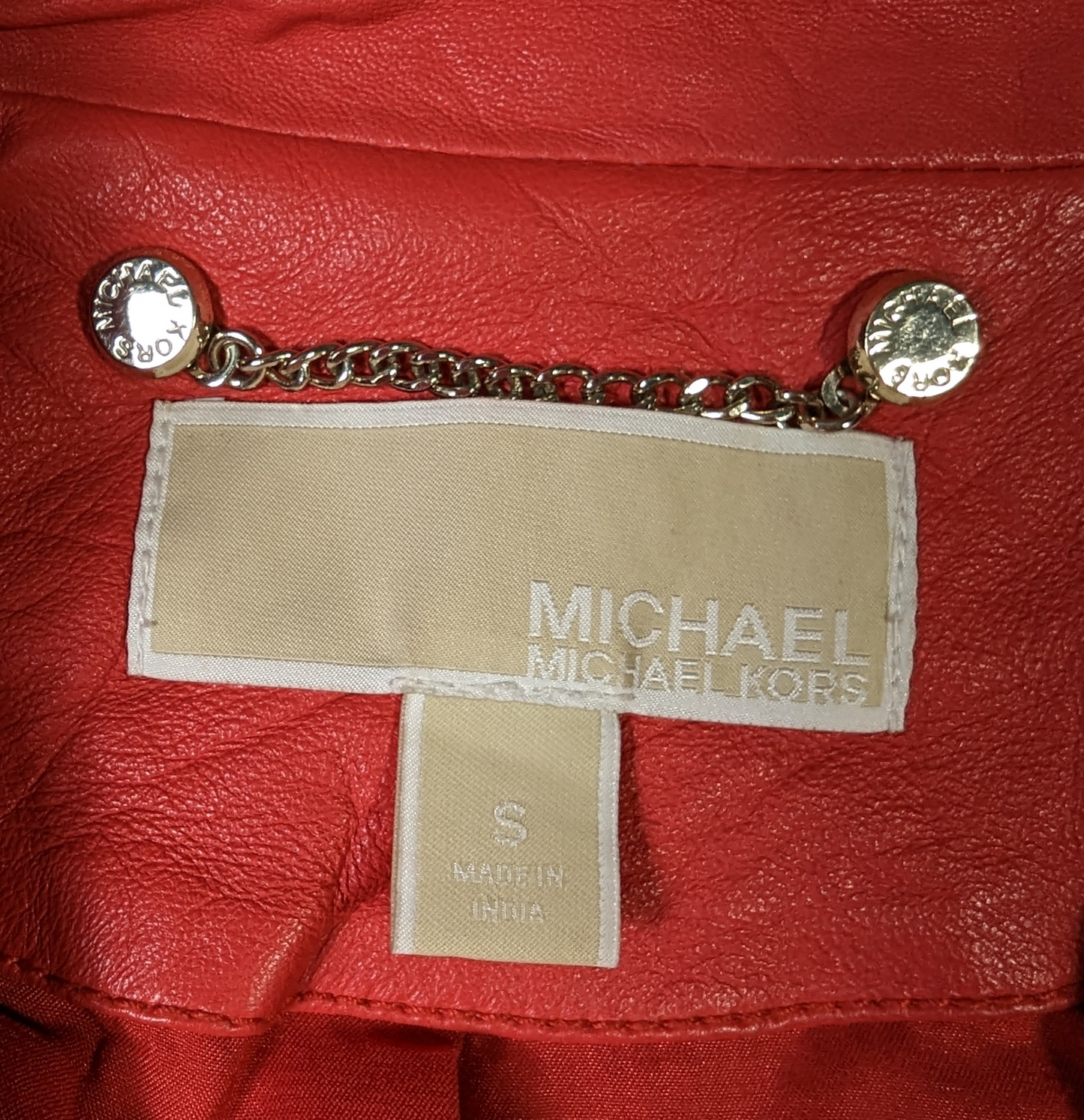 Michael KorsElevate your style with this Michael Kors moto jacket, crafted from genuine lambskin leather. The classic shade of red and gold hardware create a timeless design thaJacketMichael Kors Red Lambskin Leather JacketMichael Kors Red Lambskin Leather Jacket