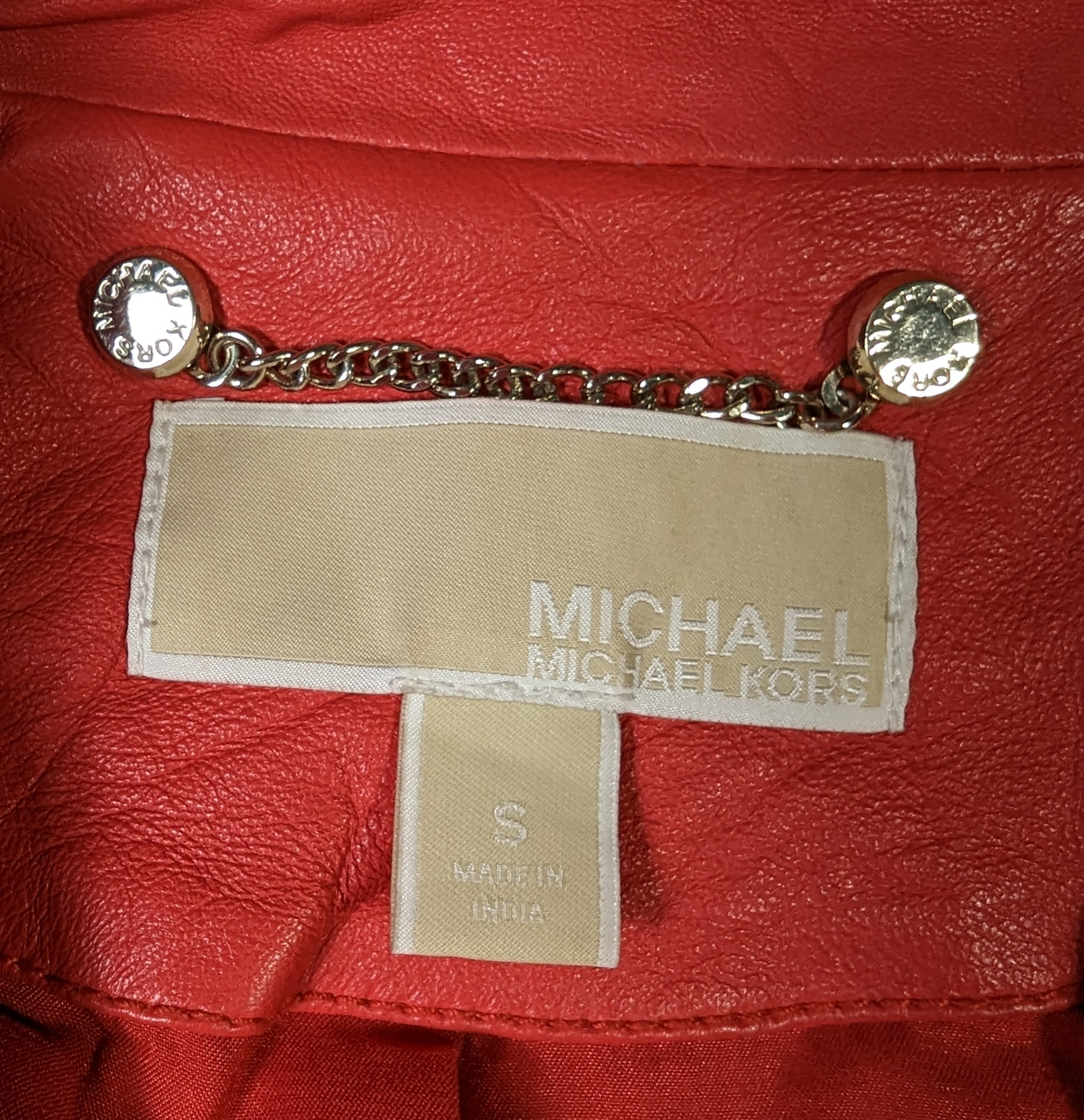 Michael KorsElevate your style with this Michael Kors moto jacket, crafted from genuine lambskin leather. The classic shade of red and gold hardware create a timeless design thaJacketMichael Kors Red Lambskin Leather JacketMichael Kors Red Lambskin Leather Jacket