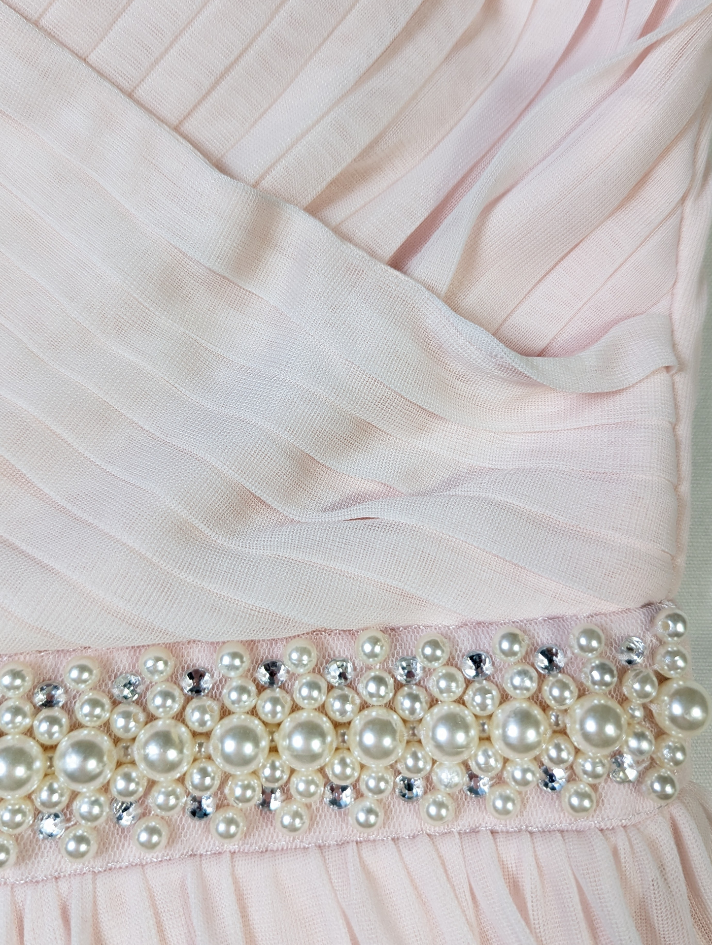 David's Bridal Pale Pink Prom Dress - NWTDavid's Bridal Pale Pink Prom Dress is designed for elegant occasions. The beautiful chiffon fabric and pearl and rhinestone accents are subtle and sophisticated, wh