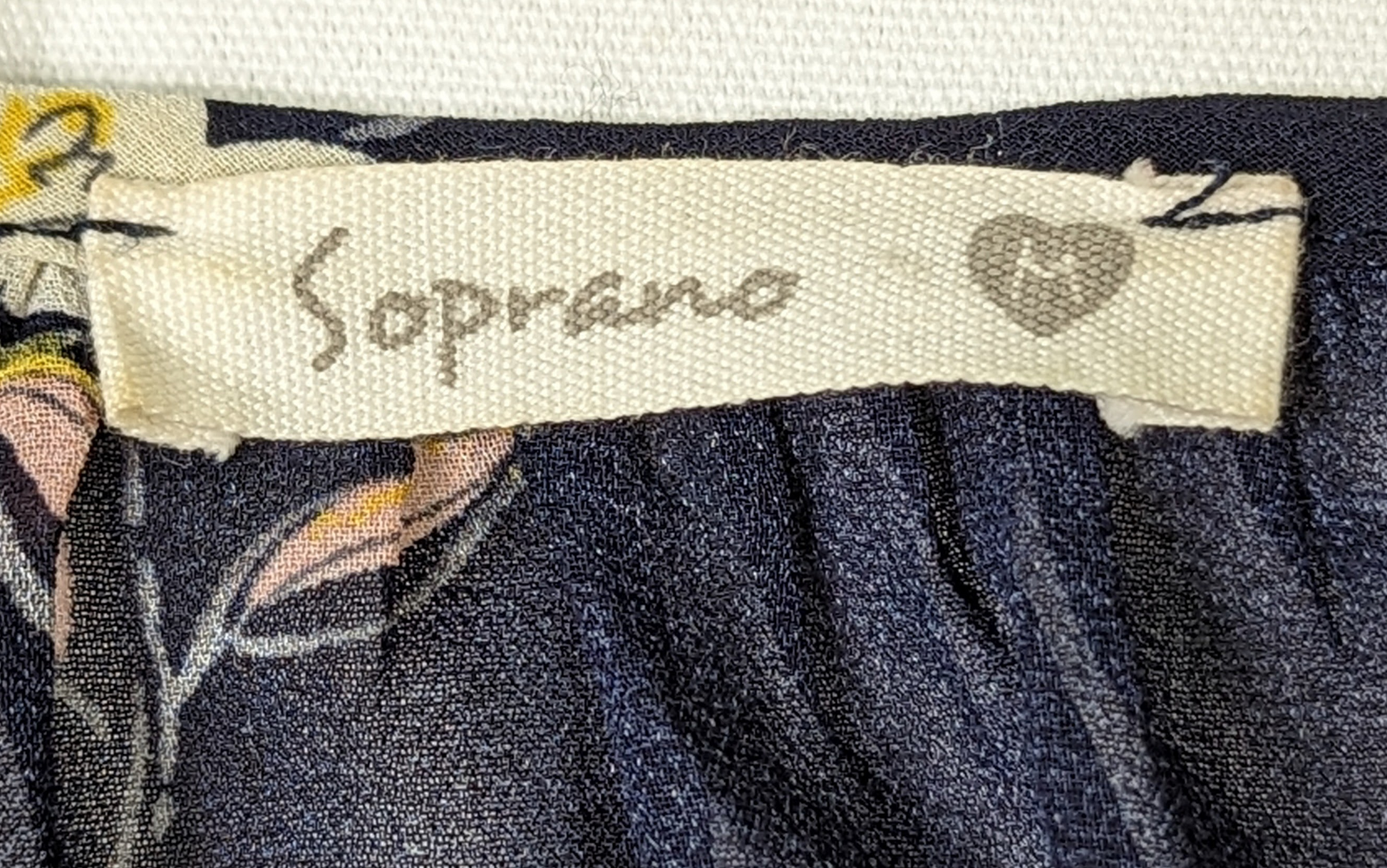 SopranoLive your life in full bloom with this captivating, navy floral blouse. Its cold-shoulder, crochet lace, and sheer fabric give a glam girly feel that's perfect for wShirts & TopsSoprano Cold Shoulder Floral BlouseSoprano Cold Shoulder Floral Blouse
