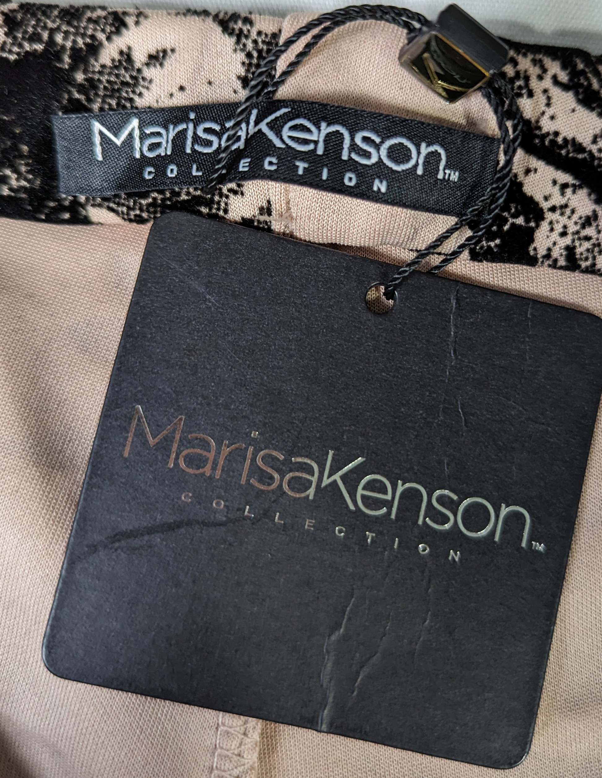 Marisa Kenson Blush Flare Pants with Black floral print NWT Brand new with tags size M Marisa Kenson collection flare pants in the Perla style. Light pink background with a black felt floral print. Elastic waist band. Very eMarisa Kenson Blush Flare PantsPants