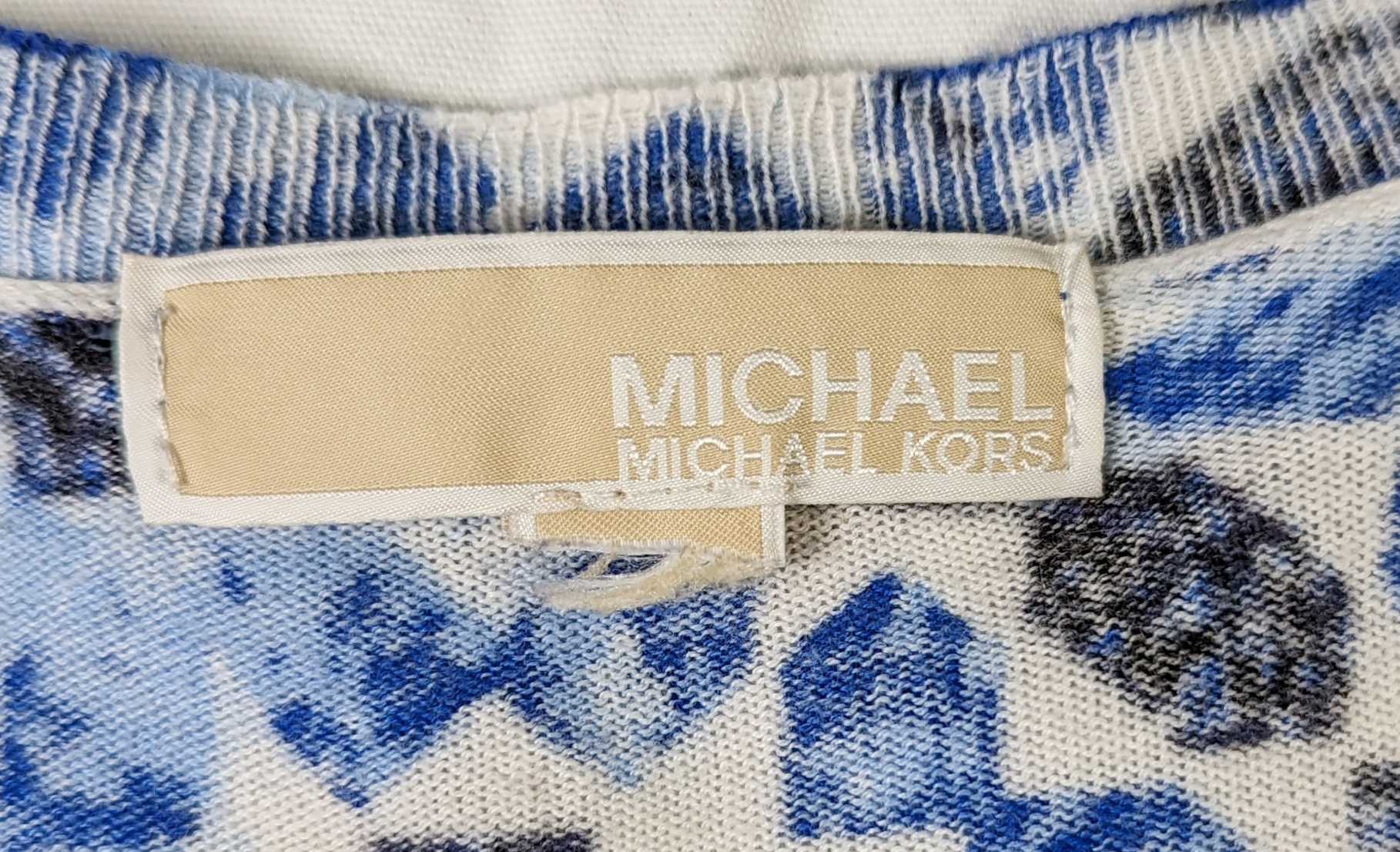 Michael KorsThe Michael Kors Kaleidoscope Print Sweater is a lightweight knit garment perfect for transitional weather. Its vivid kaleidoscope print adds a statement-making toucSweaterMichael Kors Kaleidoscope Print SweaterMichael Kors Kaleidoscope Print Sweater