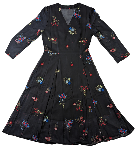 YDYThis YDY dress is perfect for any occasion. The black background with red and blue flowers create a timeless look. The sheer back and sleeves create a modern yet modDressesYDY Black Floral Dress NWTYDY Black Floral Dress NWT