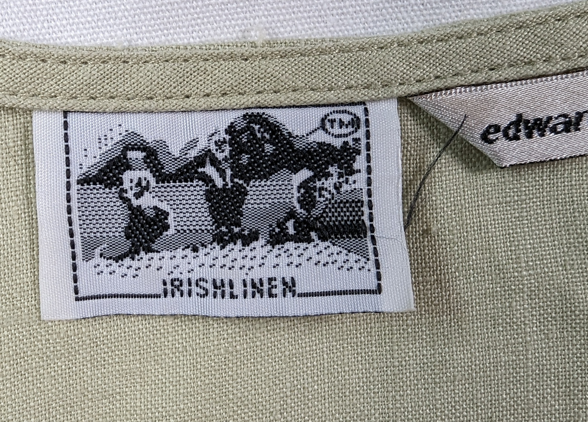 Edward Irish Linen Embroidered BlouseThe Cross Front Bodice on this Edward Linen blouse is enhanced by embroidery and beading.  The hem and sleeves feature scalloping with the side hem has added embroidEdward Irish Linen Embroidered BlouseBlouse