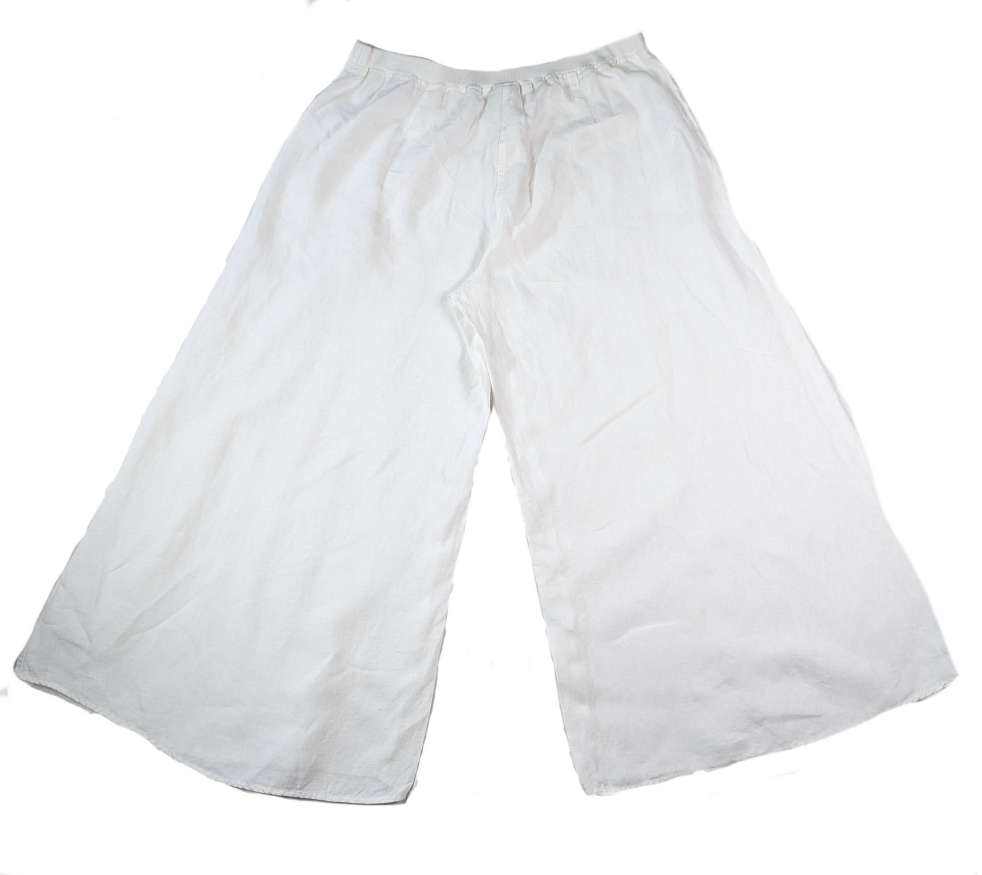Kleen White Linen Wide Leg PantsSuper cool linen pants, perfect for Spring and Summer!  These Linen pants feature a cropped length, elastic waist and button/zipper closure.  So stylish and on trendKleen White Linen Wide Leg PantsPants