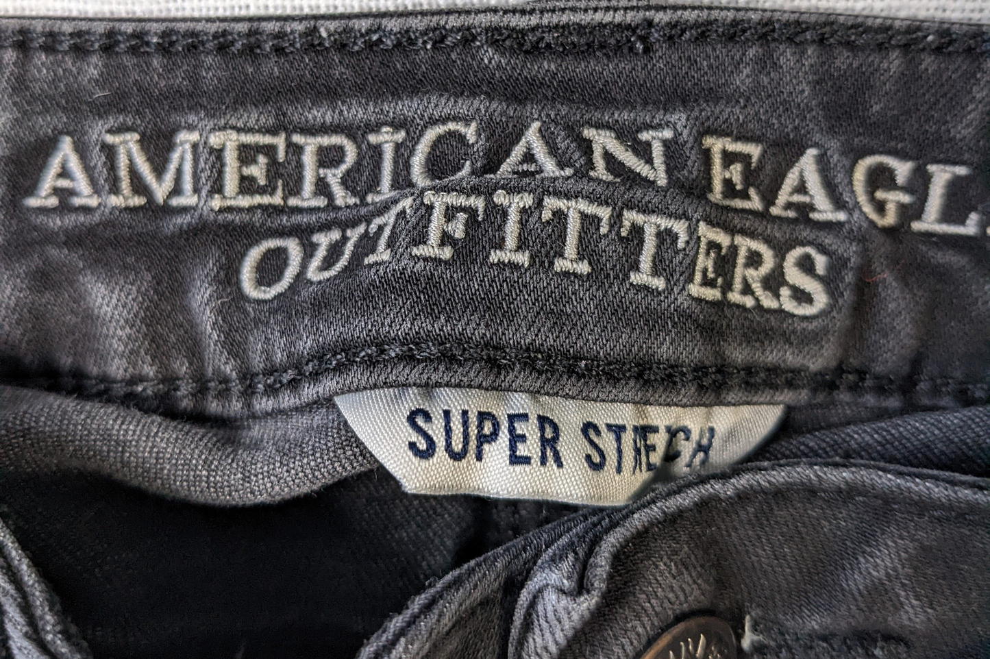 American Eagle Skinny Super Stretch Black Denim JeanSuper Stretch and Super Skinny.  Also, super long!