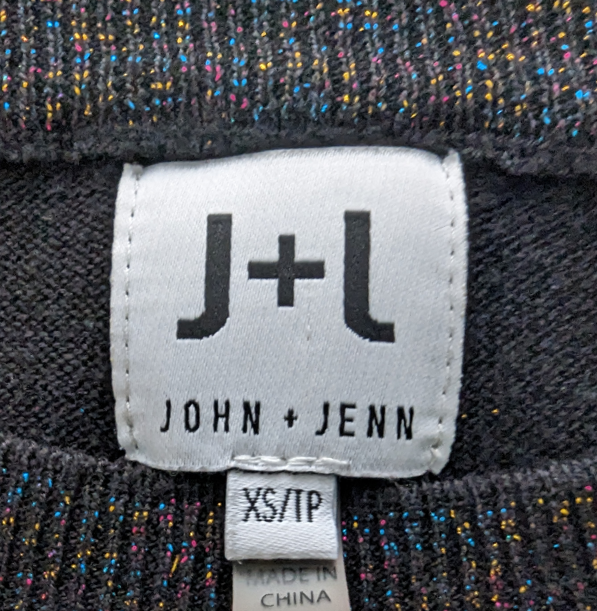 J + J John + Jenn Black Sparkly Sweater  Look effortlessly cool in the J + J John + Jenn Black Sparkly Sweater. With multicolor metallic threads and a mock neck, thi