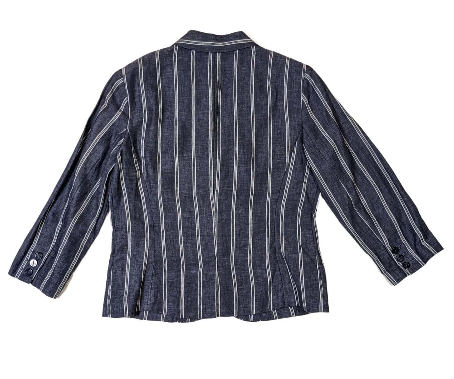 CAbi Linen Pinstripe JacketThis Jacket looks sharp with chevron styled pockets and white pinstripes on the blue linen. The 3/4 sleeves give the blazer a relaxed look.