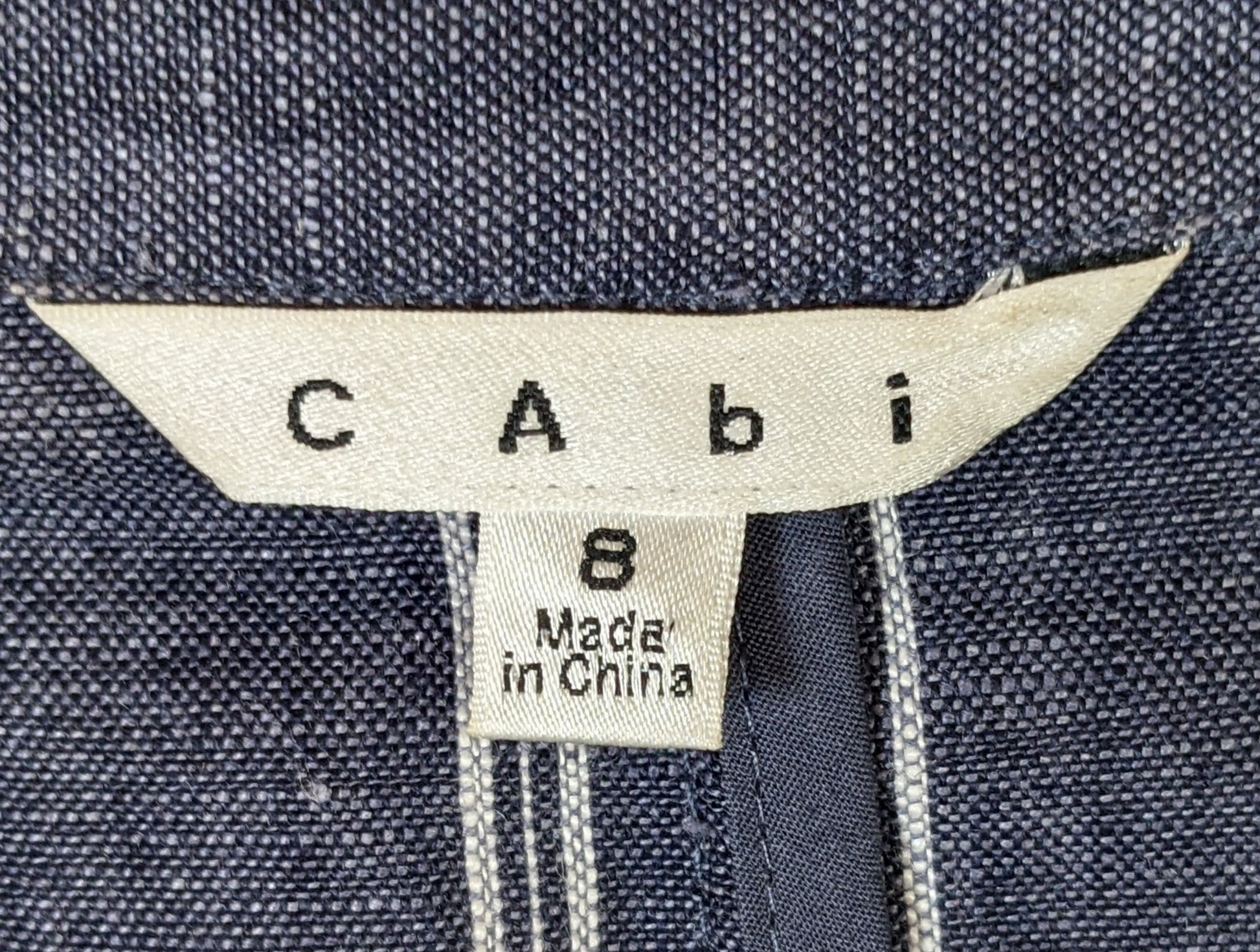 CAbi Linen Pinstripe JacketThis Jacket looks sharp with chevron styled pockets and white pinstripes on the blue linen. The 3/4 sleeves give the blazer a relaxed look.