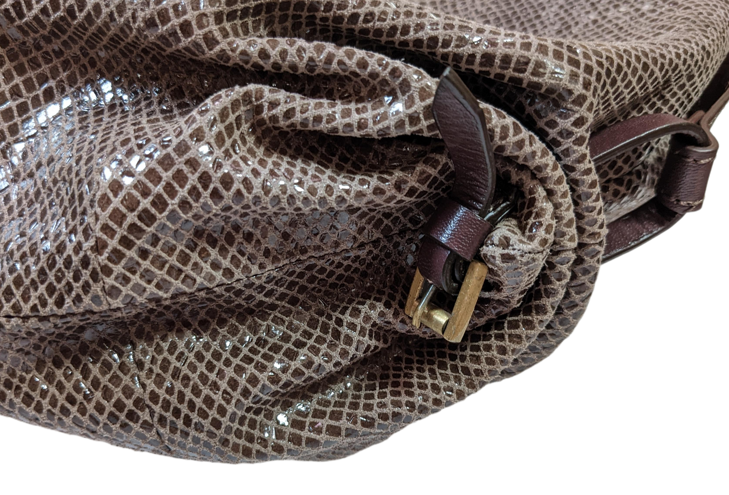 orYany Embossed Leather Handbag Elevate your style with the orYany Embossed Leather Handbag. Crafted with luxurious snake skin embossed leather, this beautiful taupe