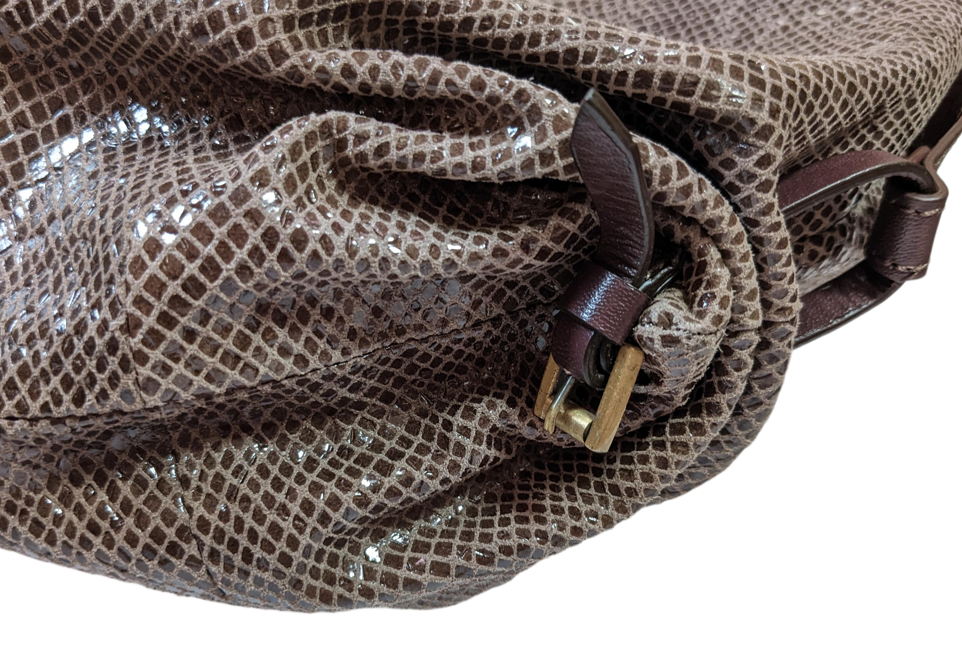 orYany Embossed Leather Handbag Elevate your style with the orYany Embossed Leather Handbag. Crafted with luxurious snake skin embossed leather, this beautiful taupe